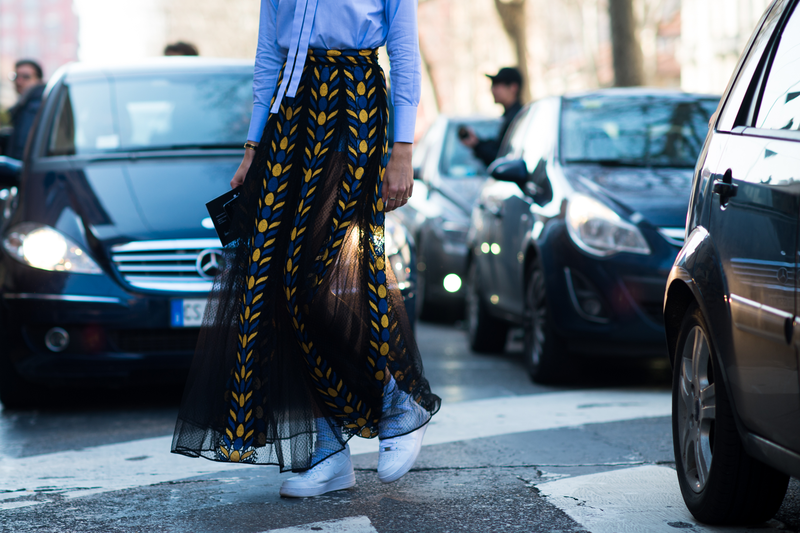 German woman wearing NIke and transparent skirt