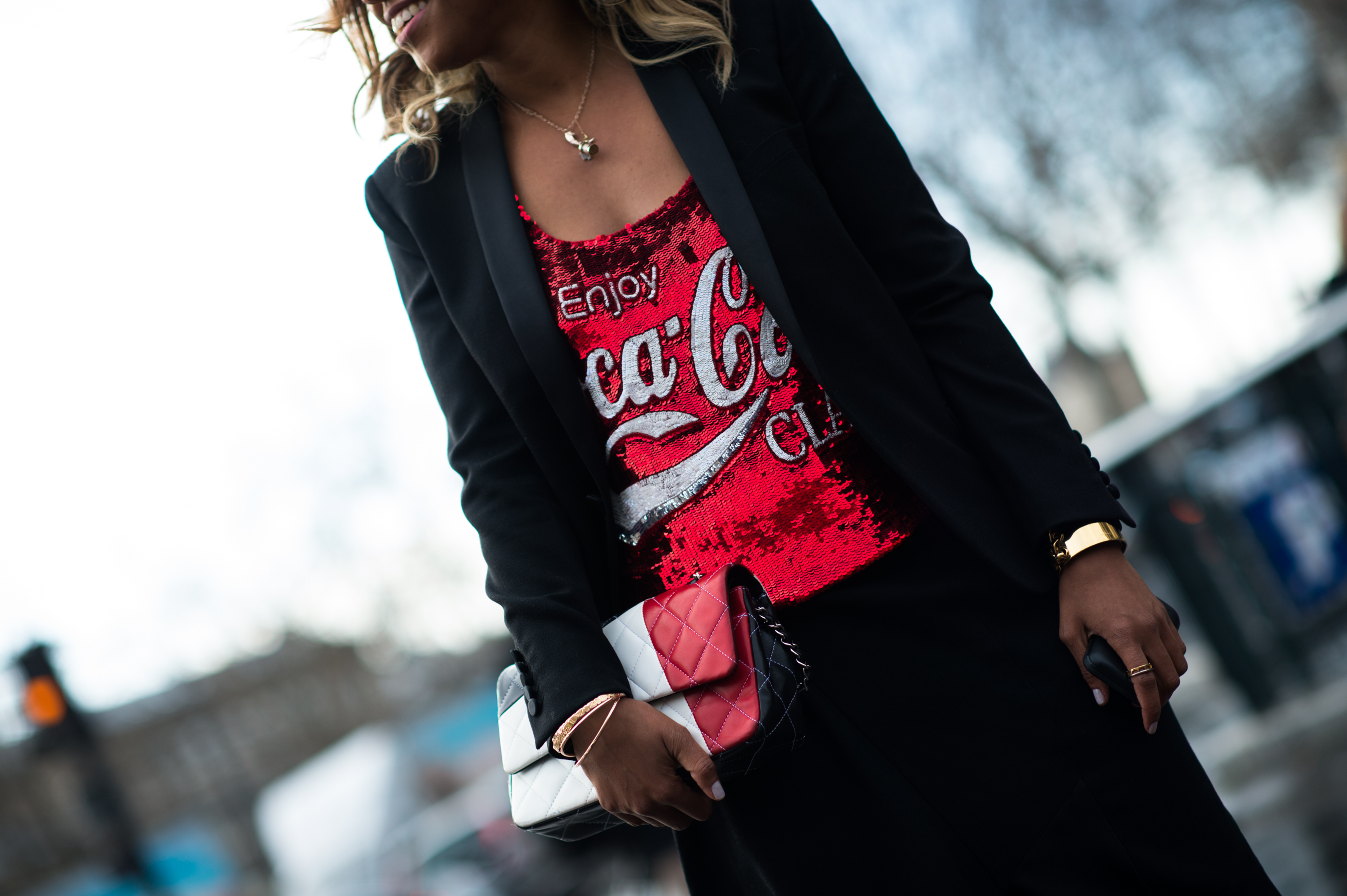 Woman wearing sequin Coca-Cola top