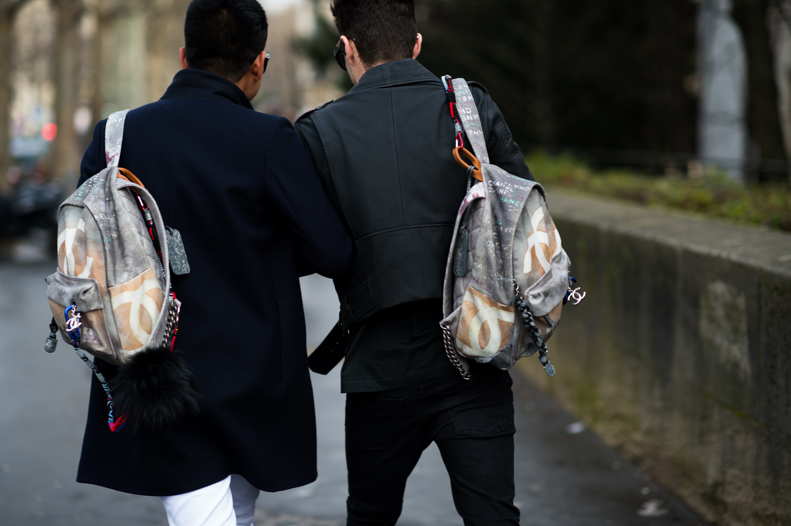 Two bloggers wearing Chanel graffiti backpack