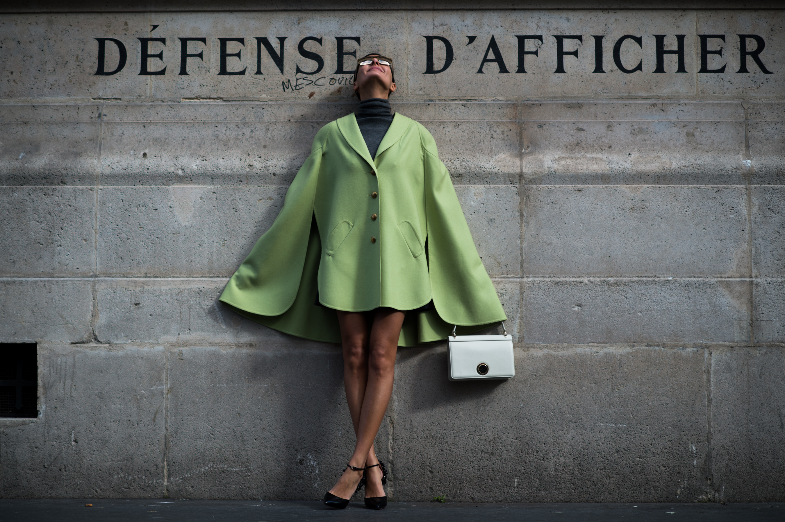 Italian woman wearing green coat