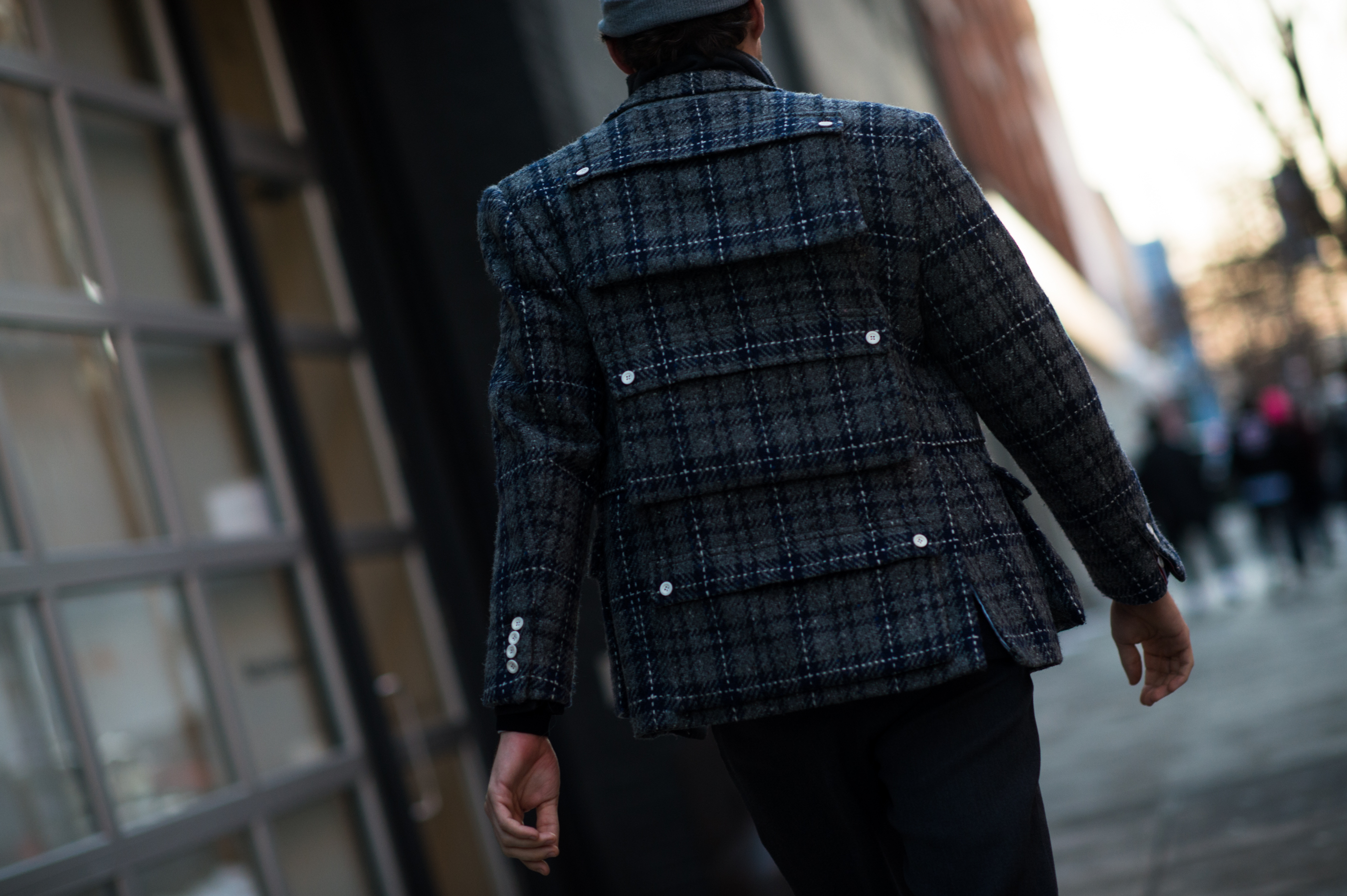 Man wearing suit jacket with pockets on back