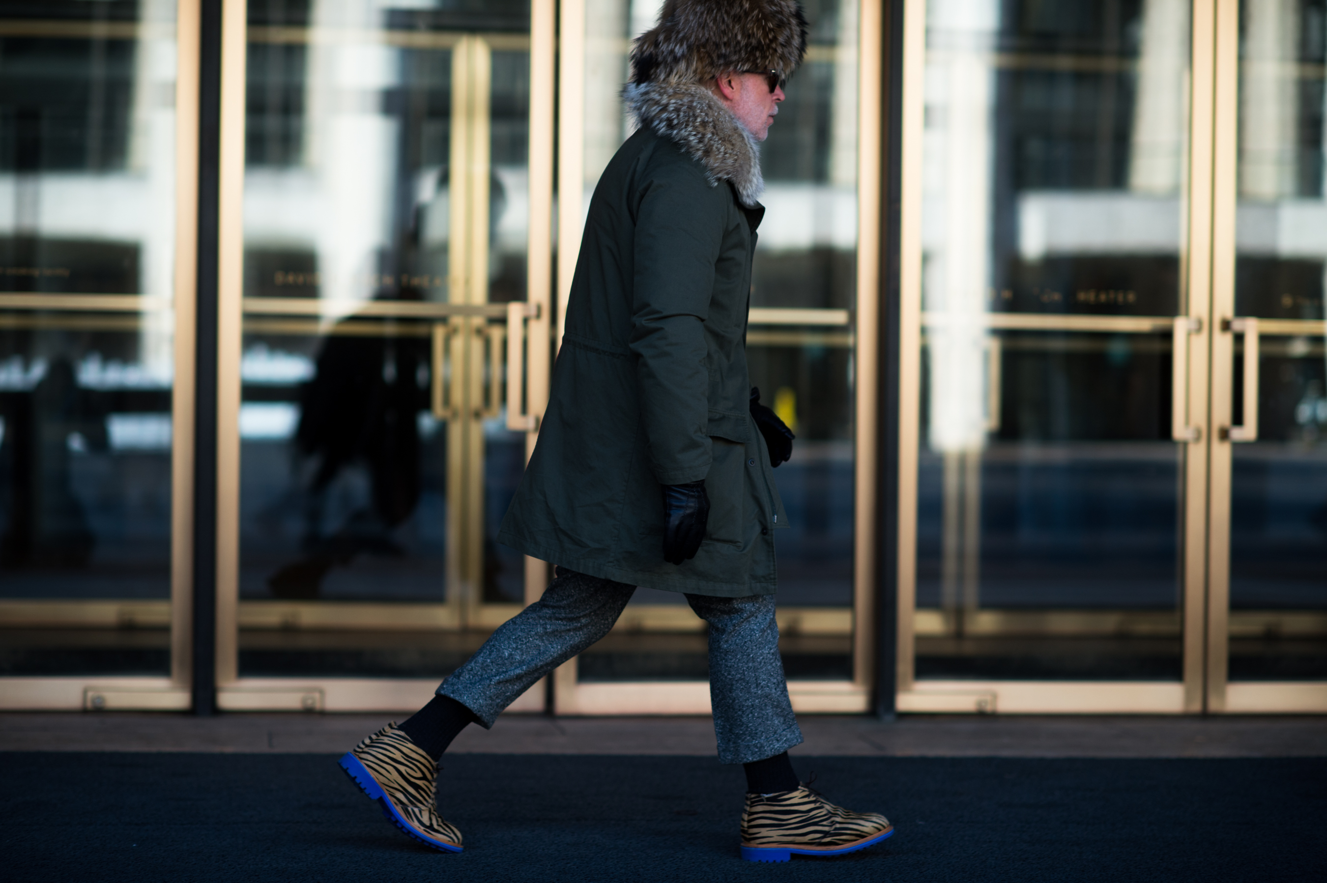 Man wearing blue soled shoes