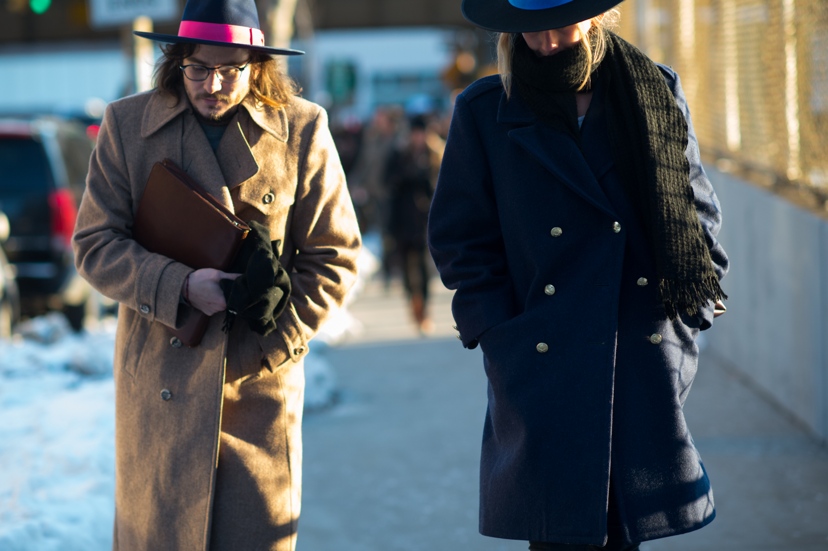 Two people wearing matching hats
