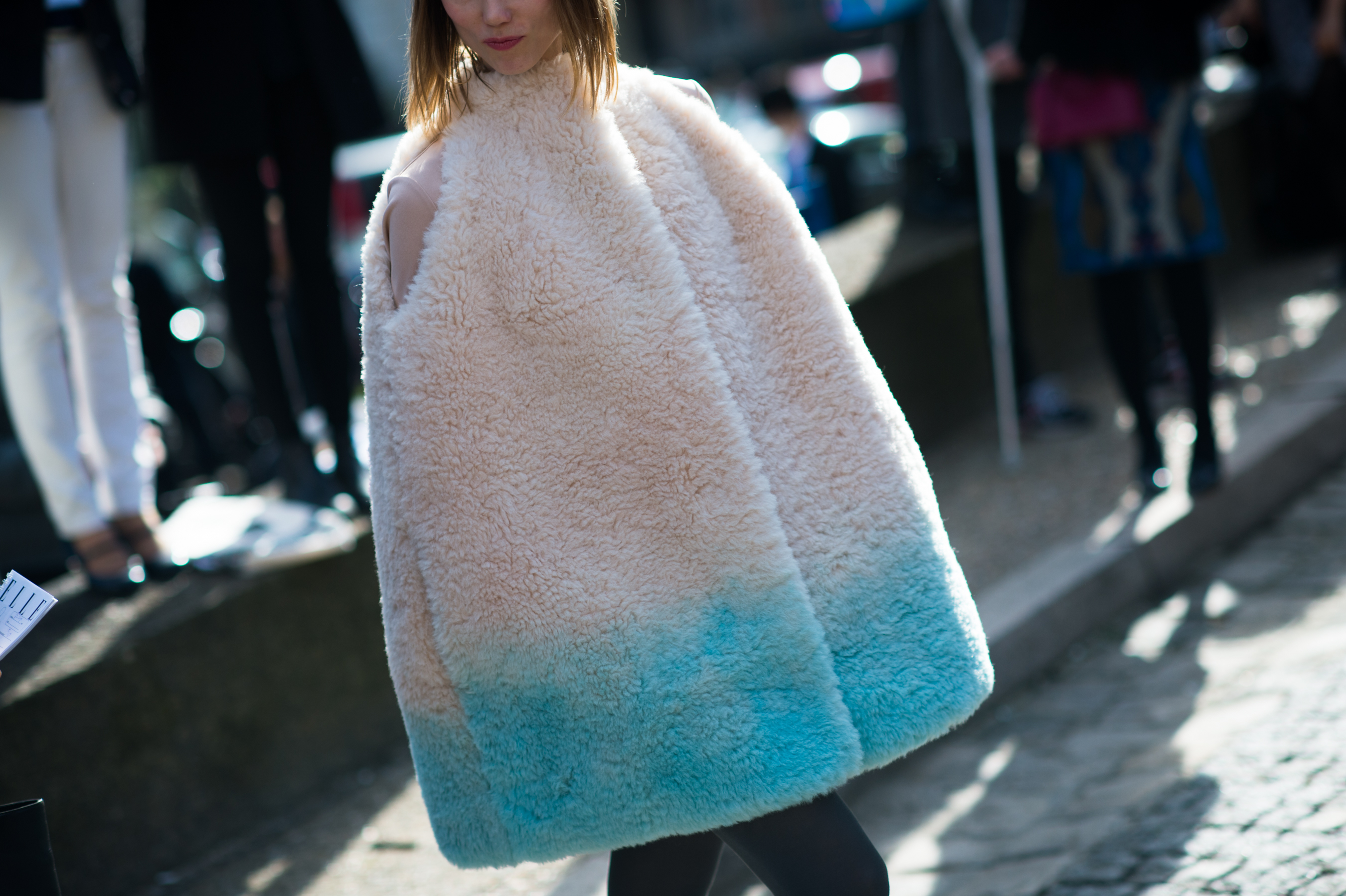 Russian woman wearing a shearling cape