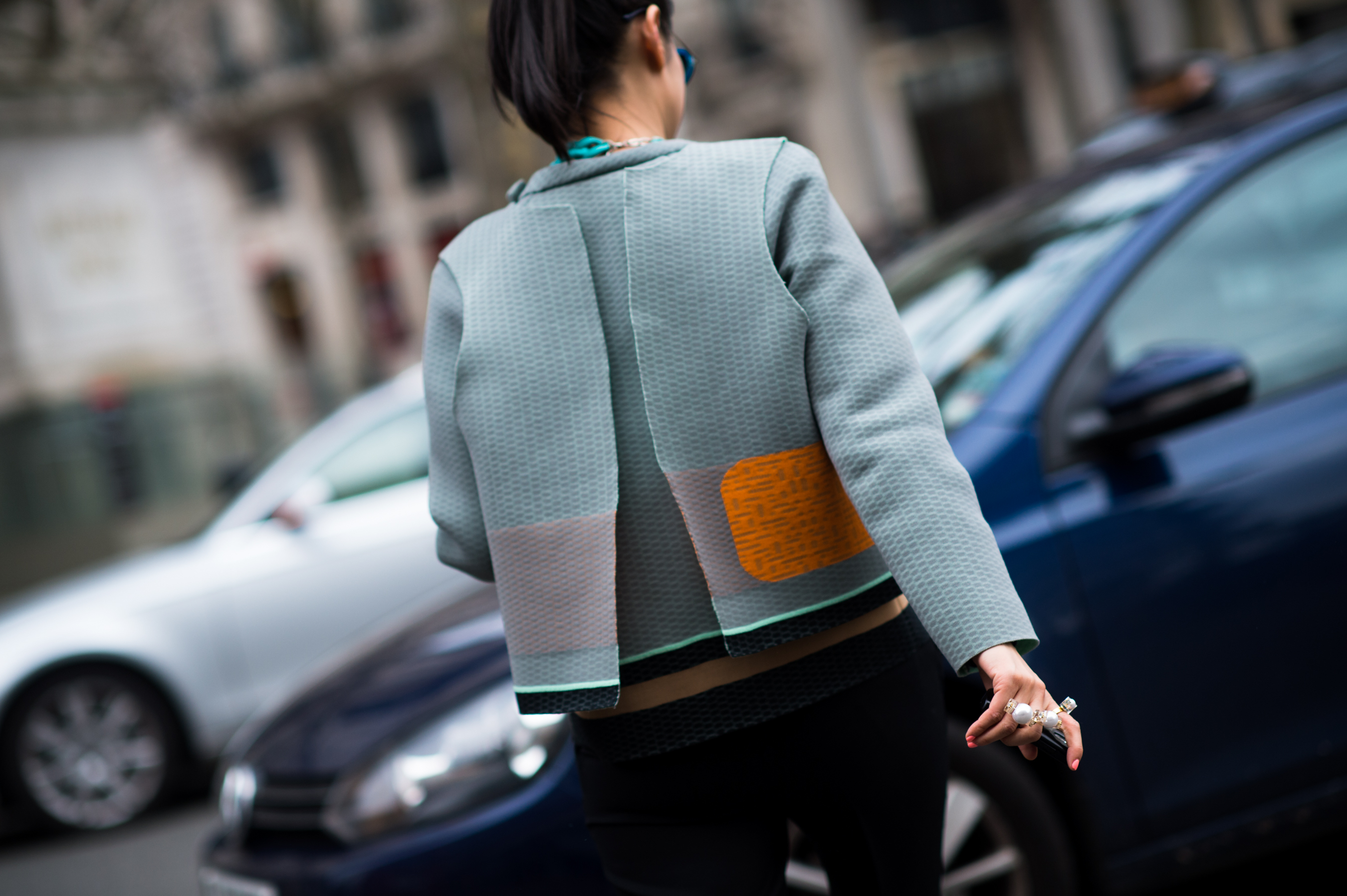 Chinese woman wearing seafoam green jacket