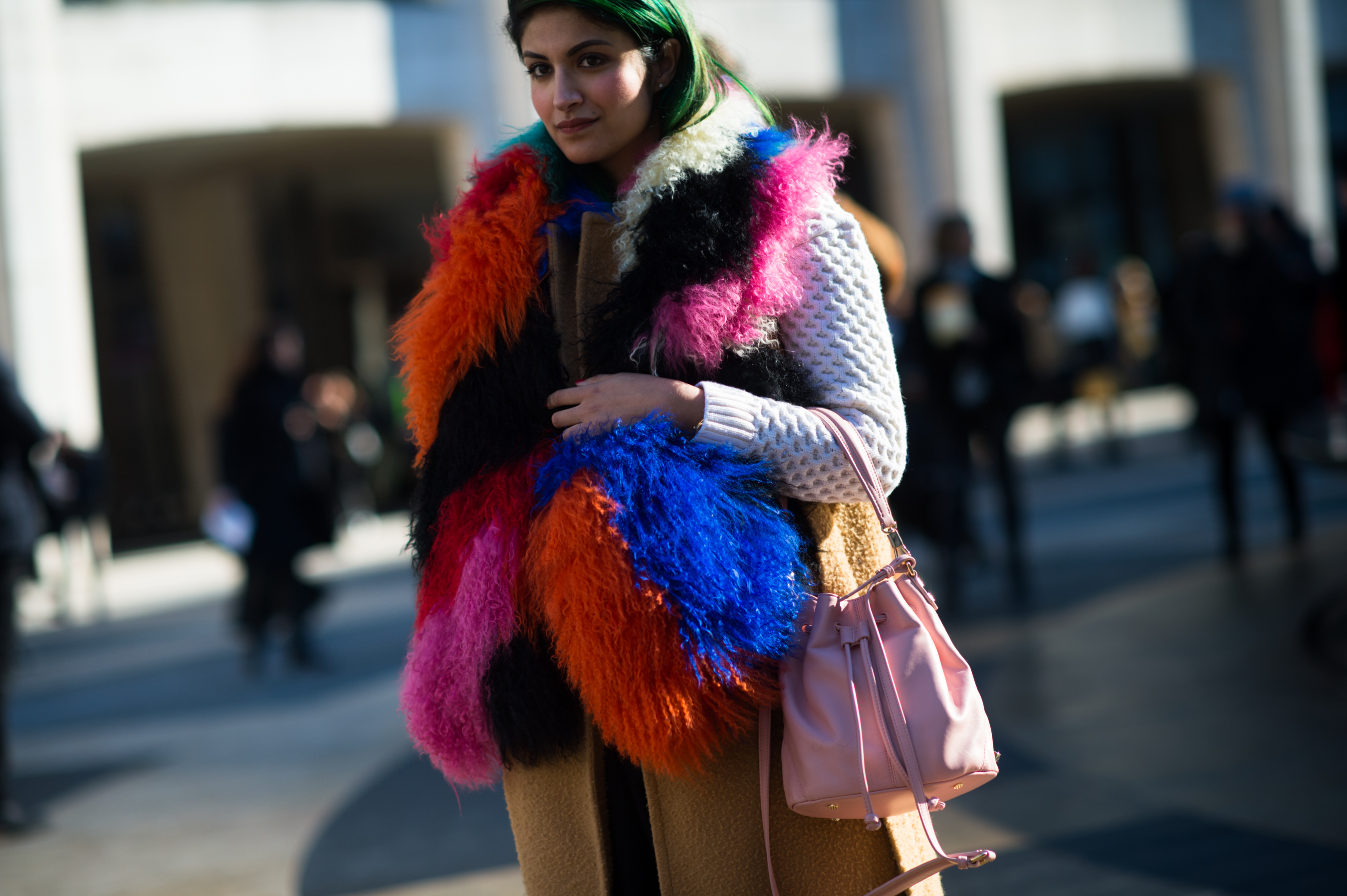 Woman wearing bright color fur