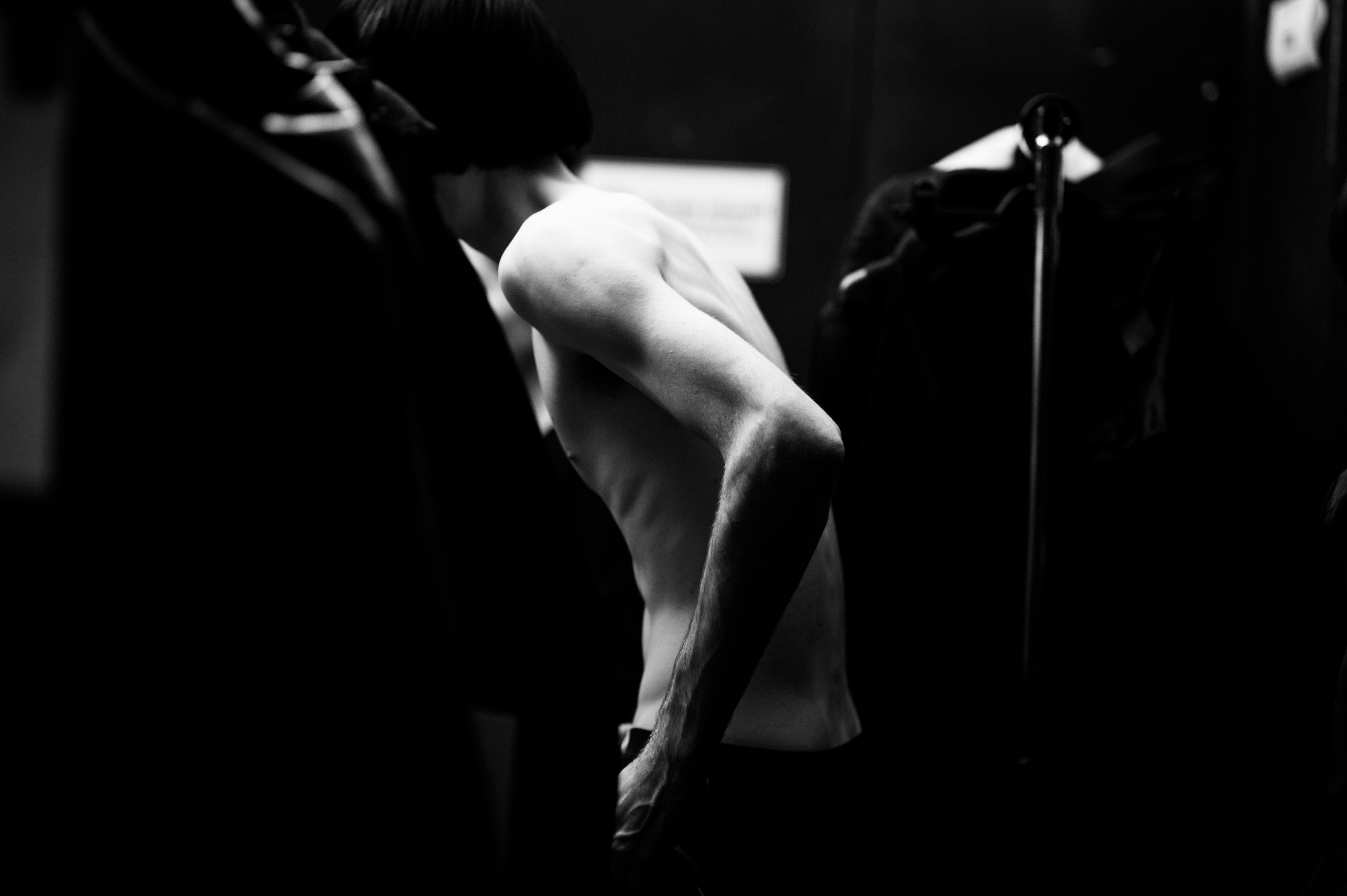 Male model changing before fashion show