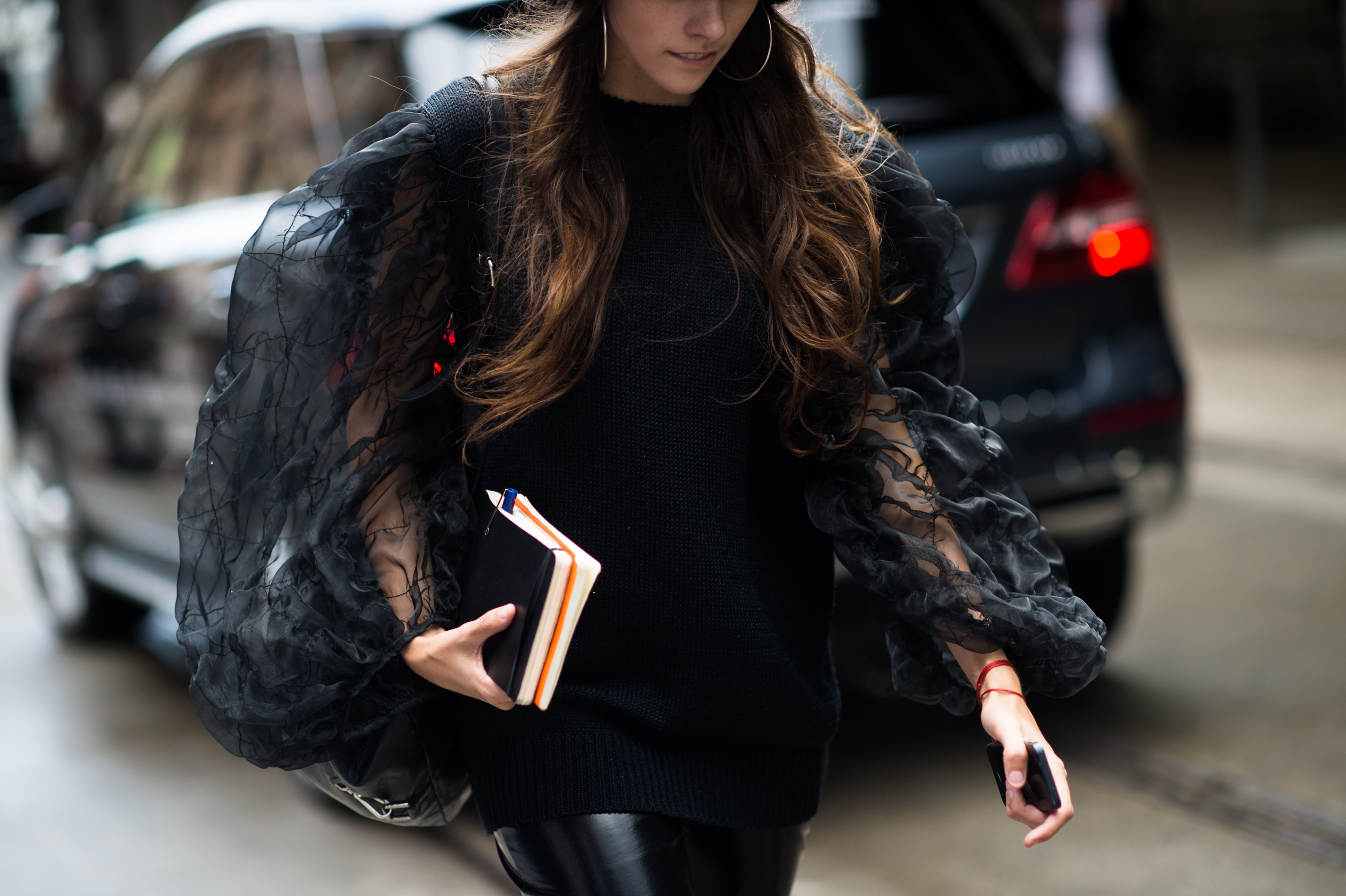 Laura Bannister wearing sheer sleeved top
