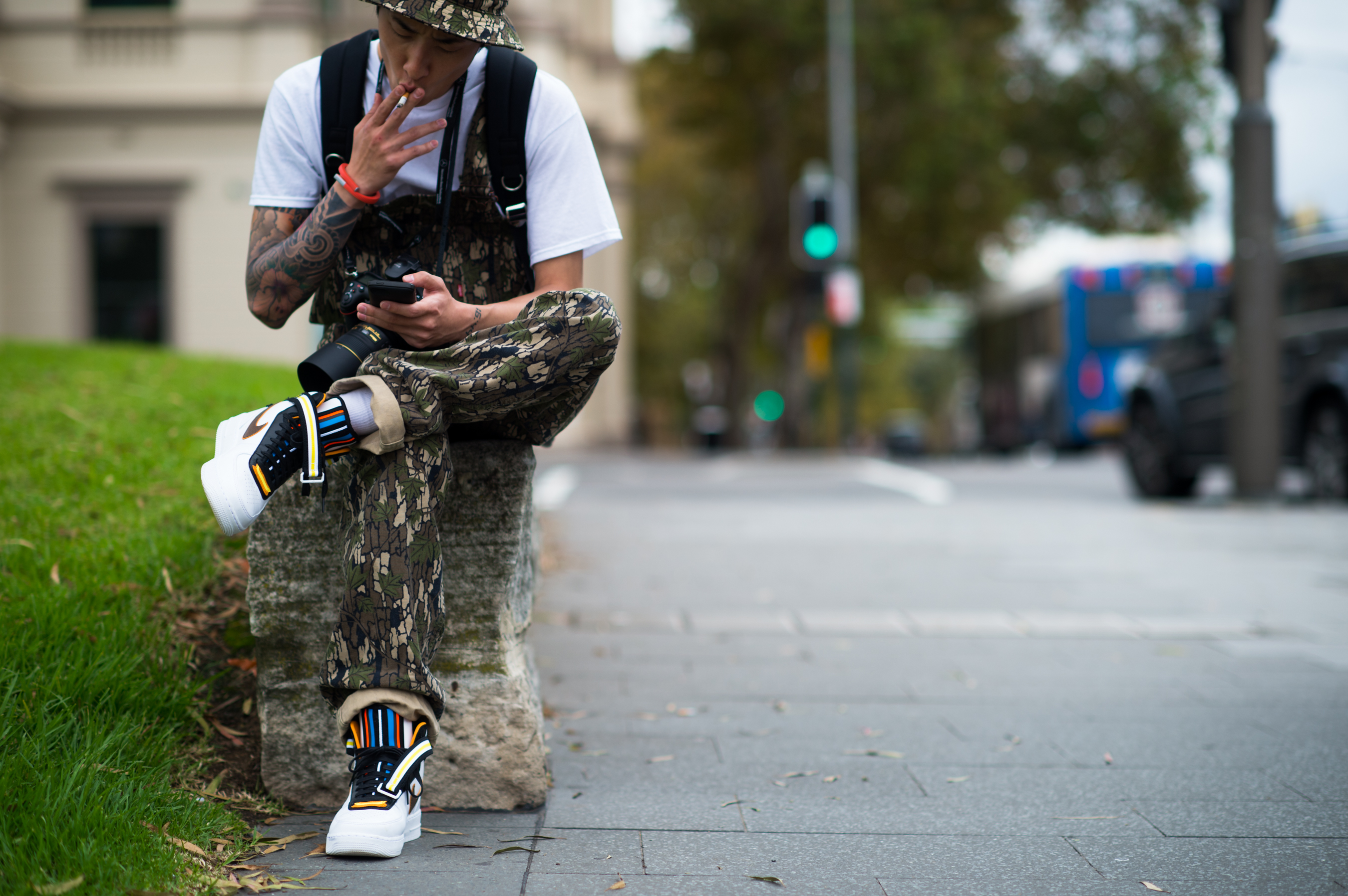 Korean photographer wearing Nike by Ricardo Tisci
