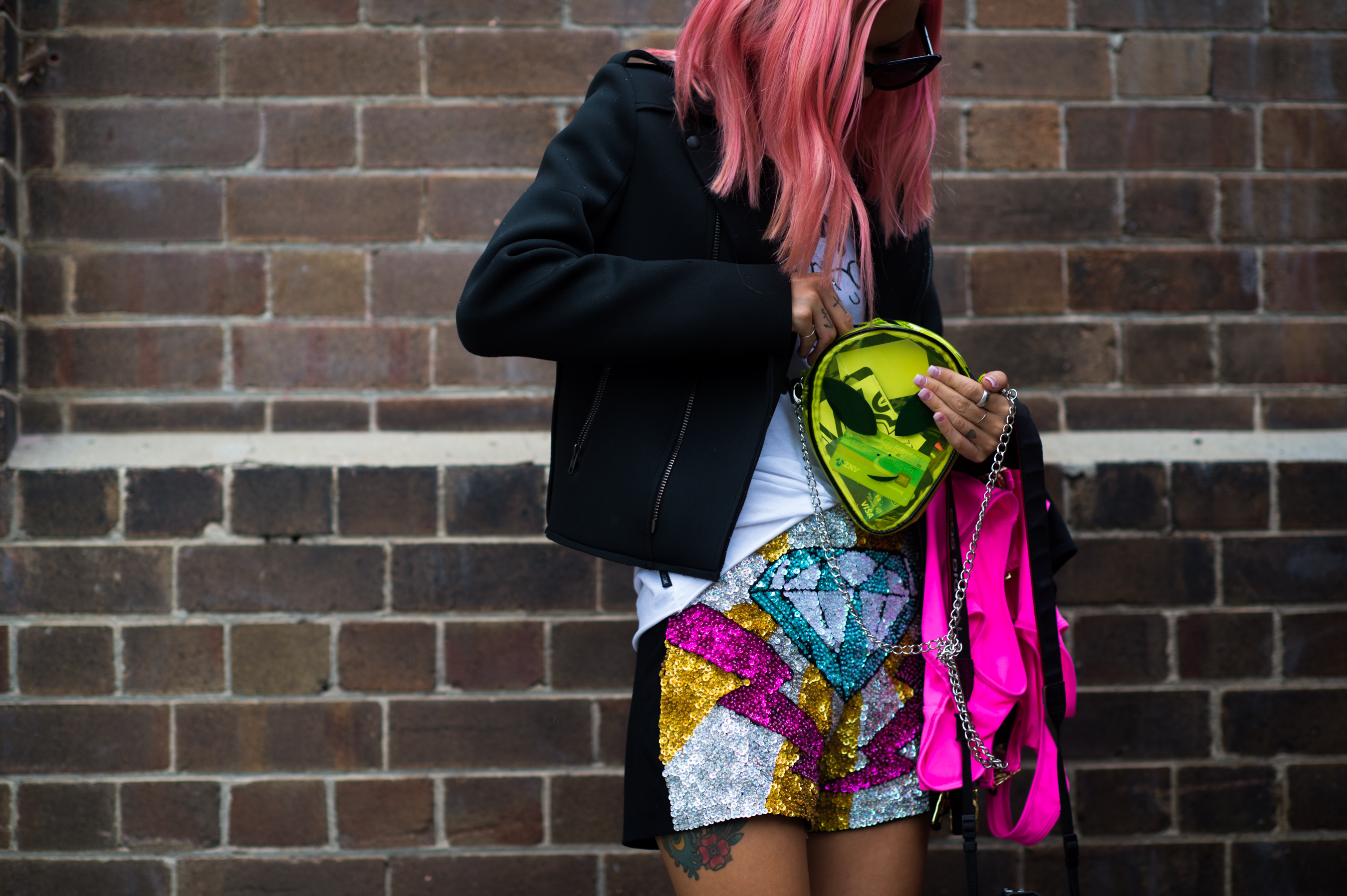 Model with pink hair and alien bag