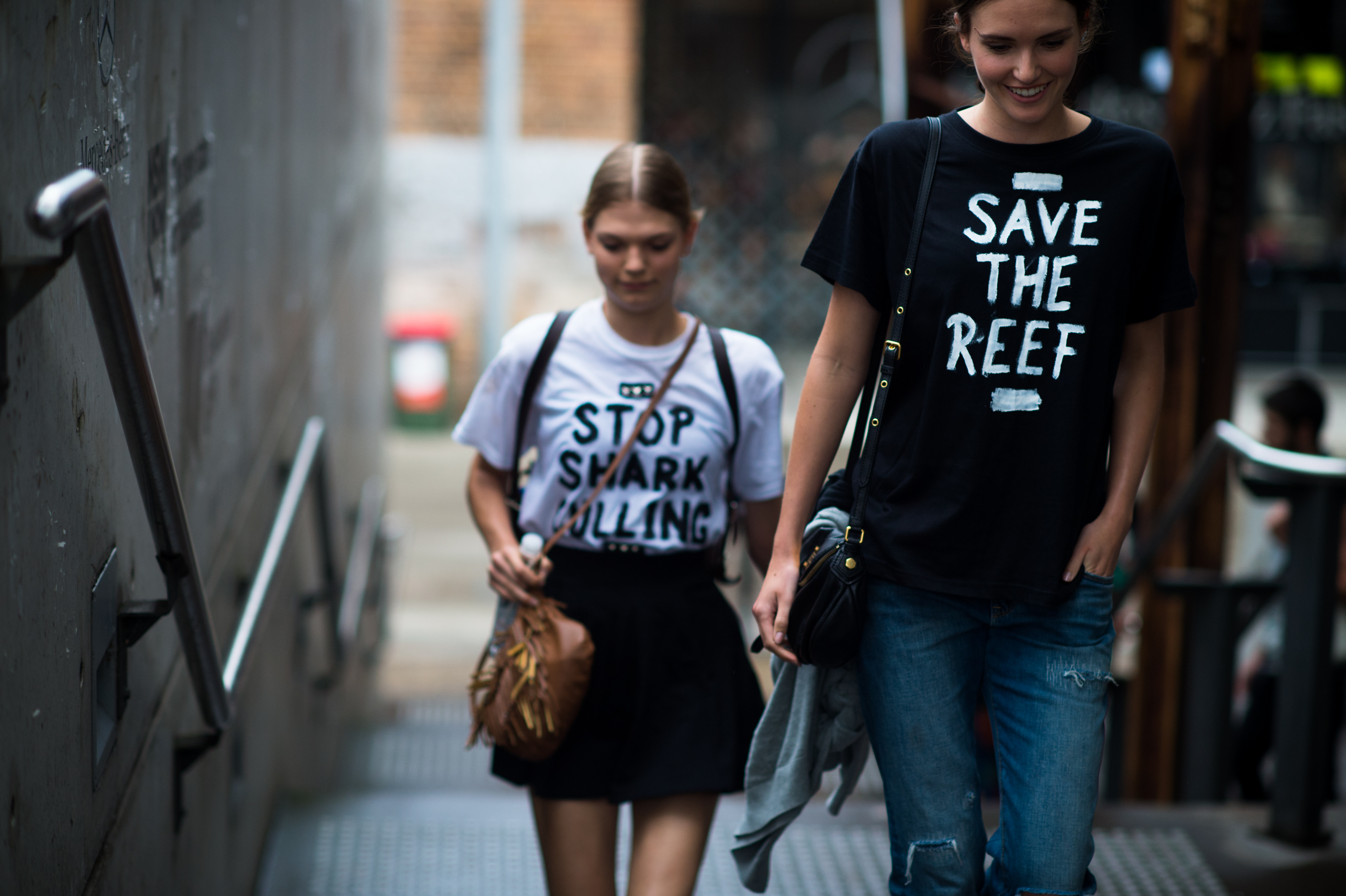 Two Australian models wearing Start the Riot shirts