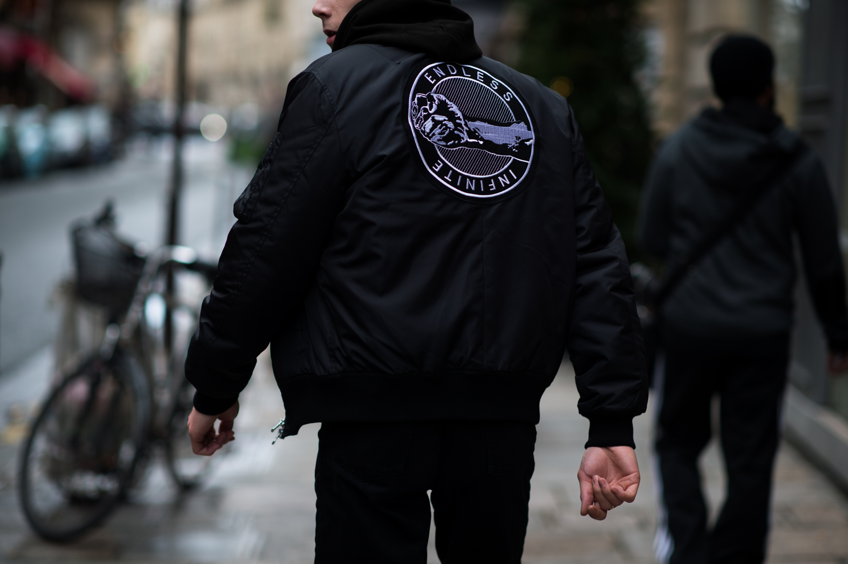 British male model wearing Endless Infinite bomber