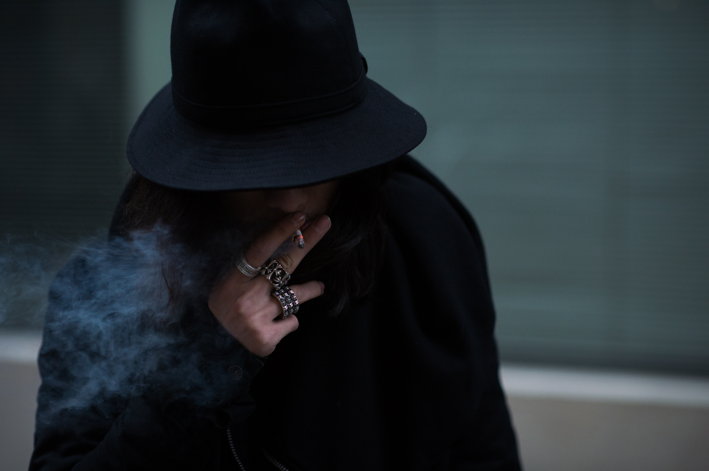 Chinese man wearing Chome Hearts rings