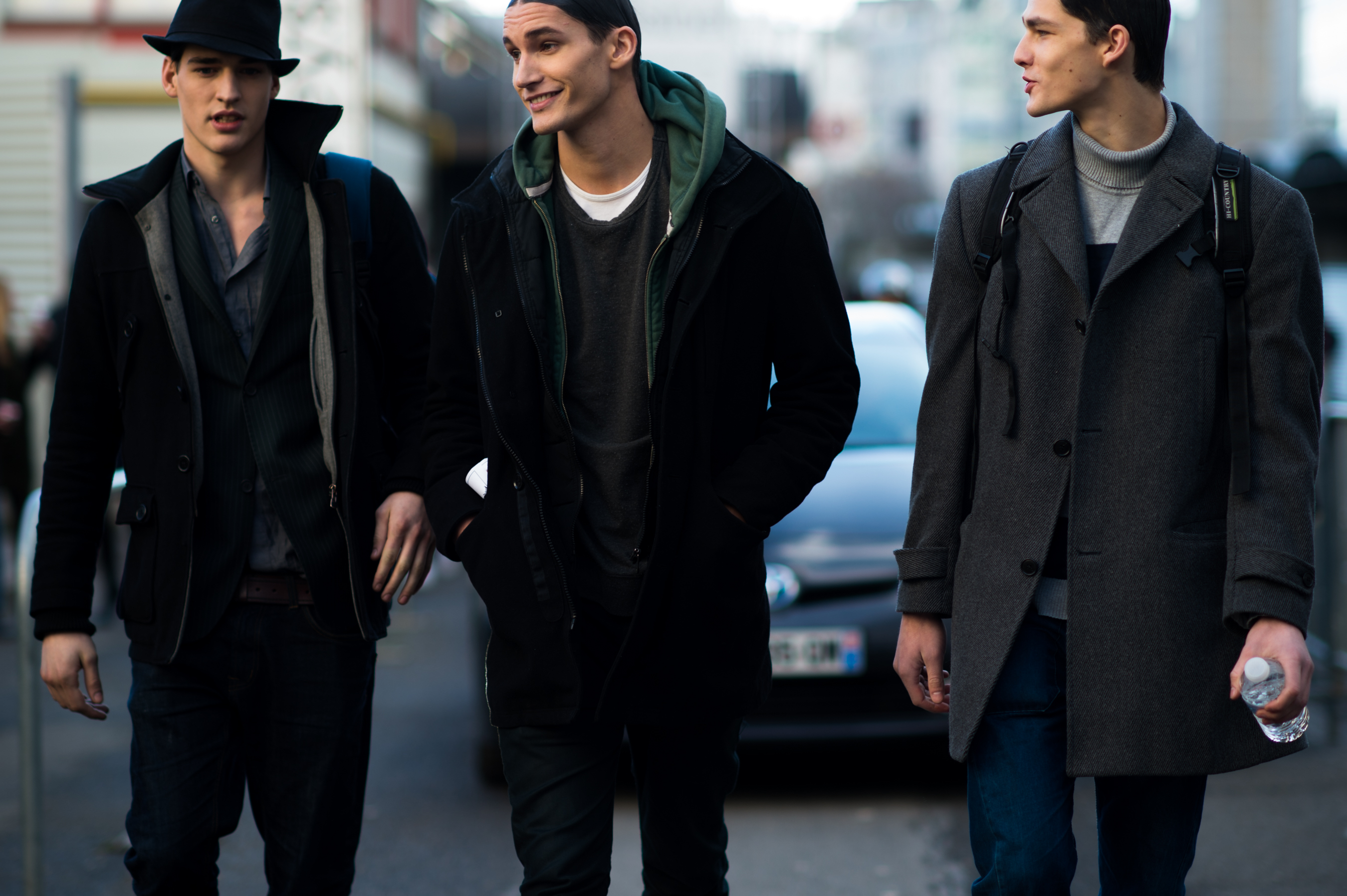 Three male models after fashion show