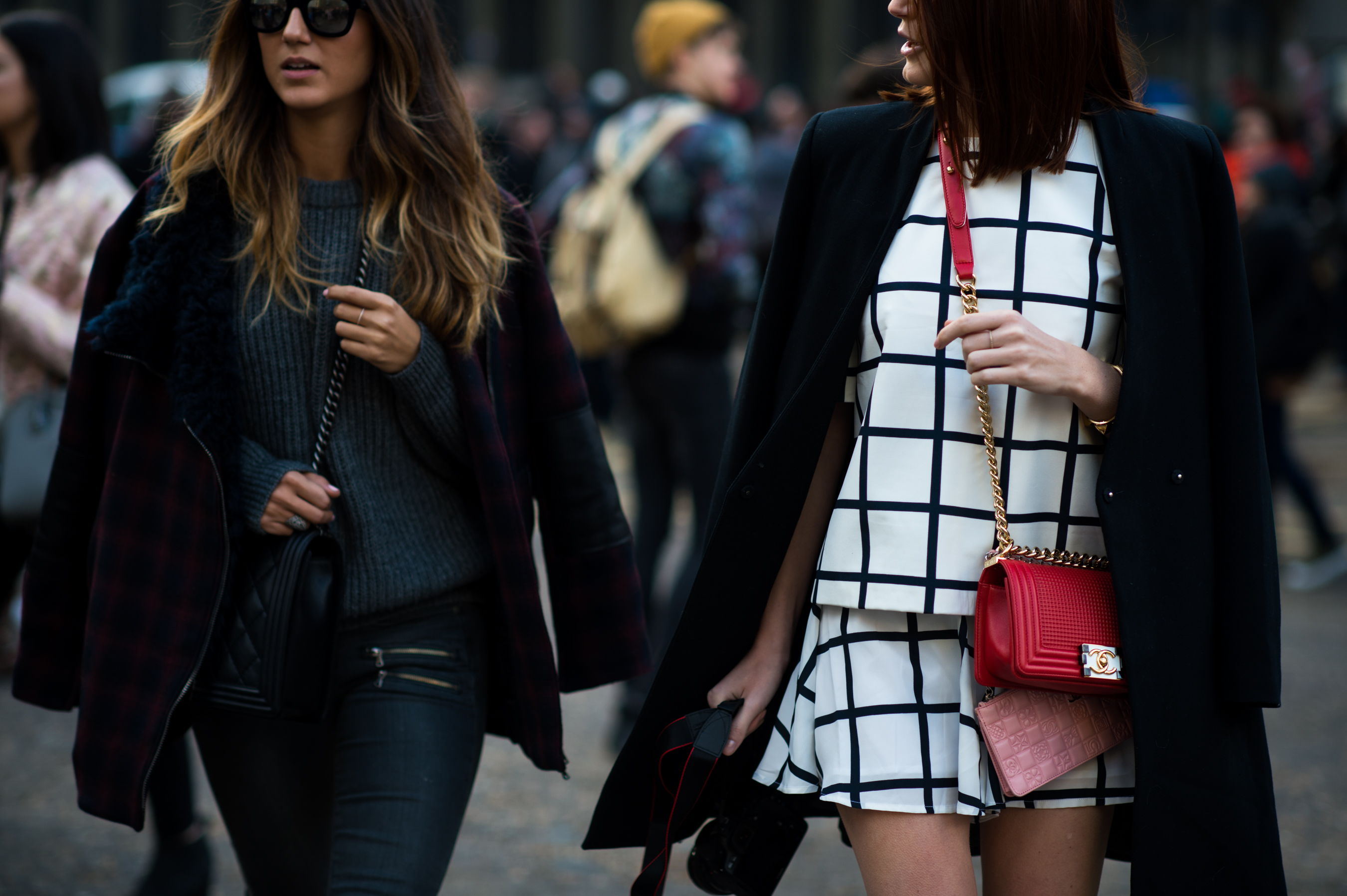 Two woman wearing Chanel Boy Bag