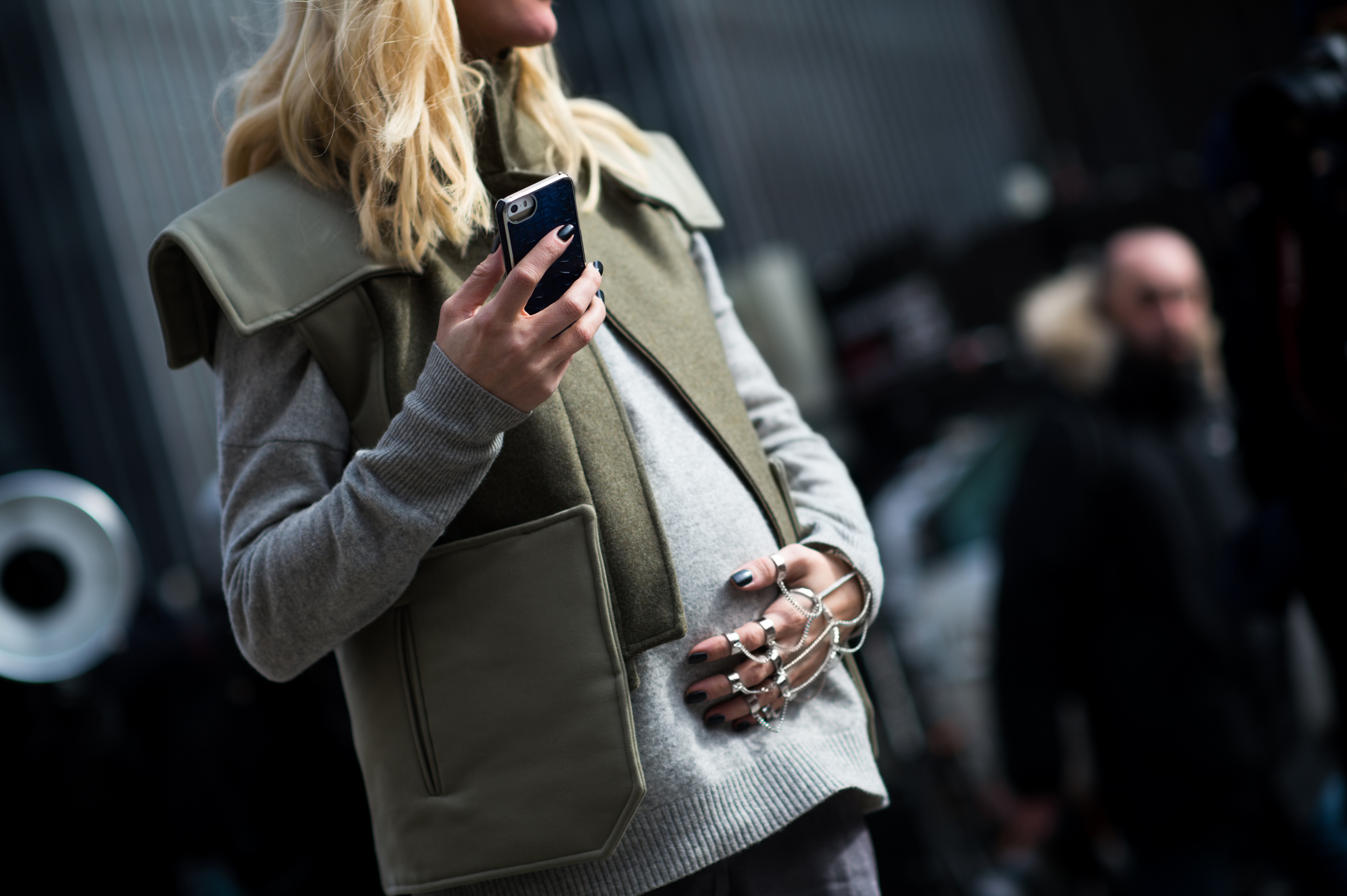 Pregnant woman wearing safari vest
