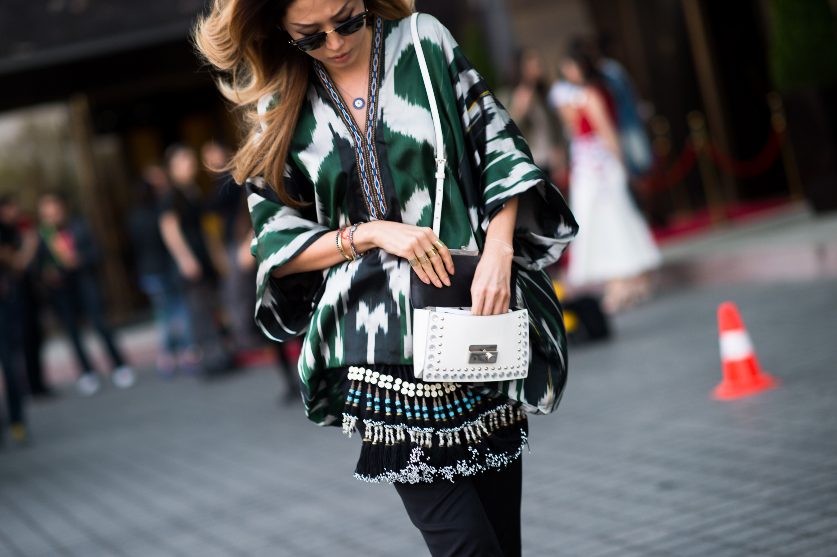 Woman wearing green silk top