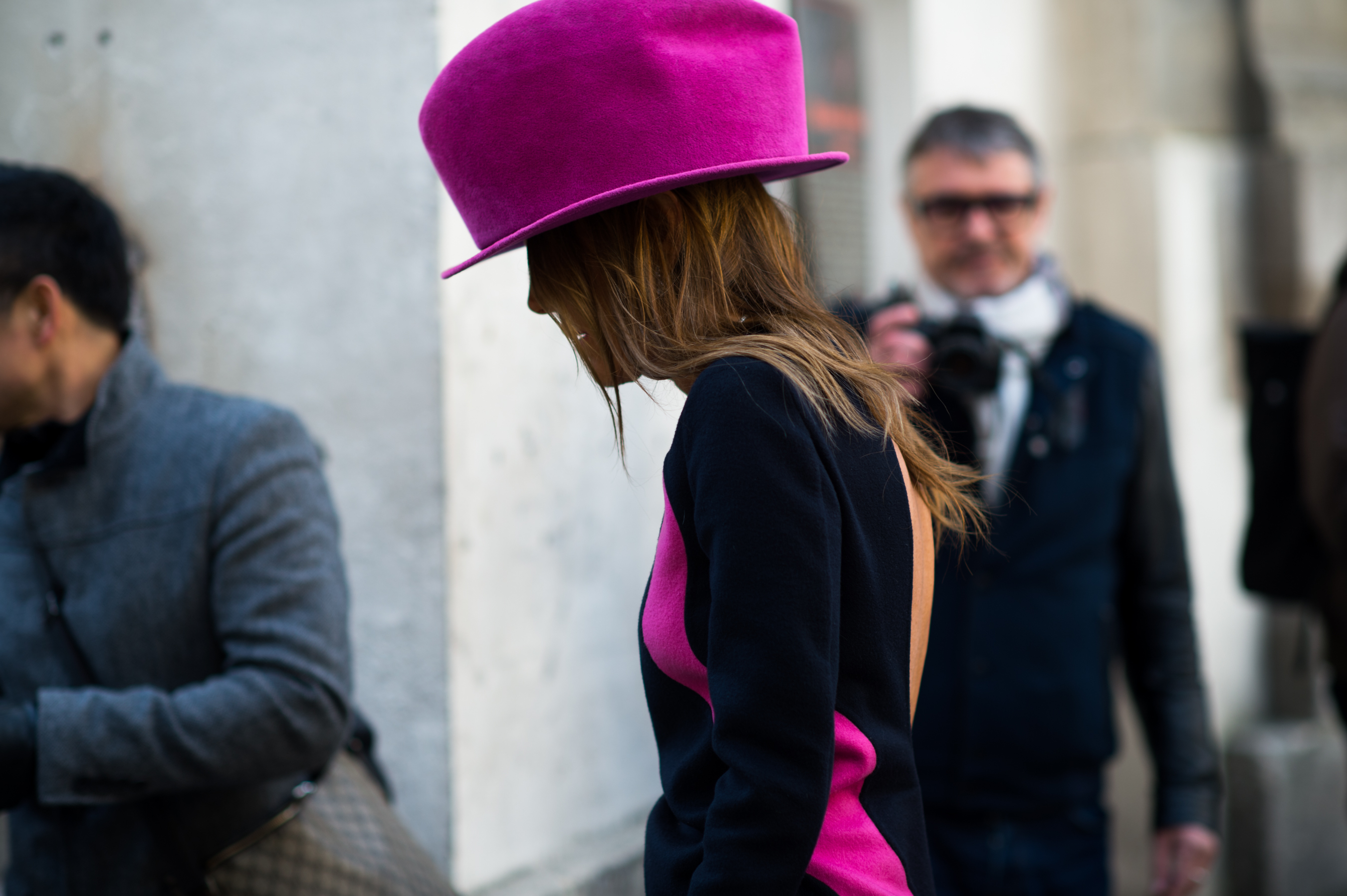 Italian woman wearing giant pink hat