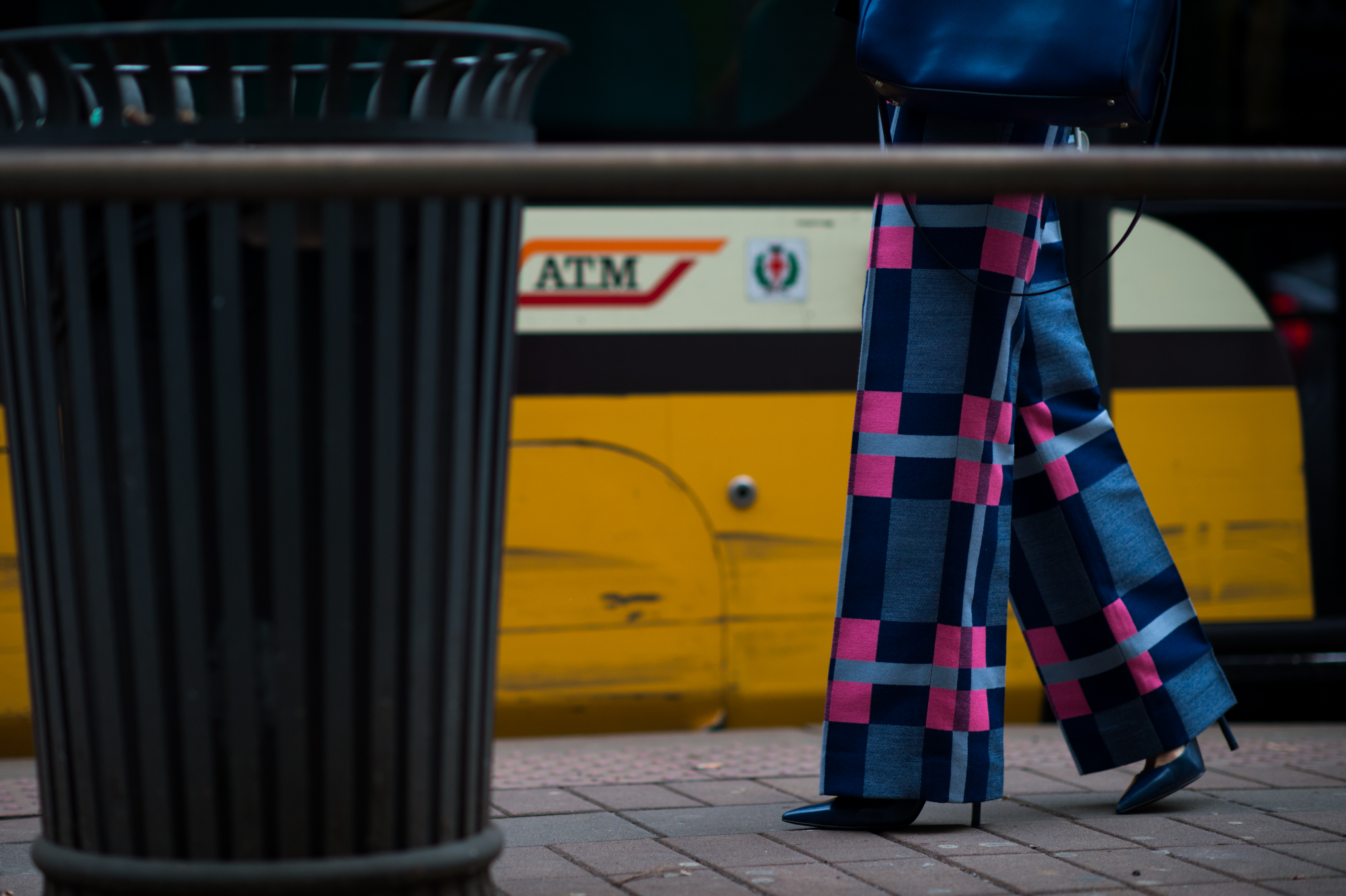 Woman wearing pink and blue pants