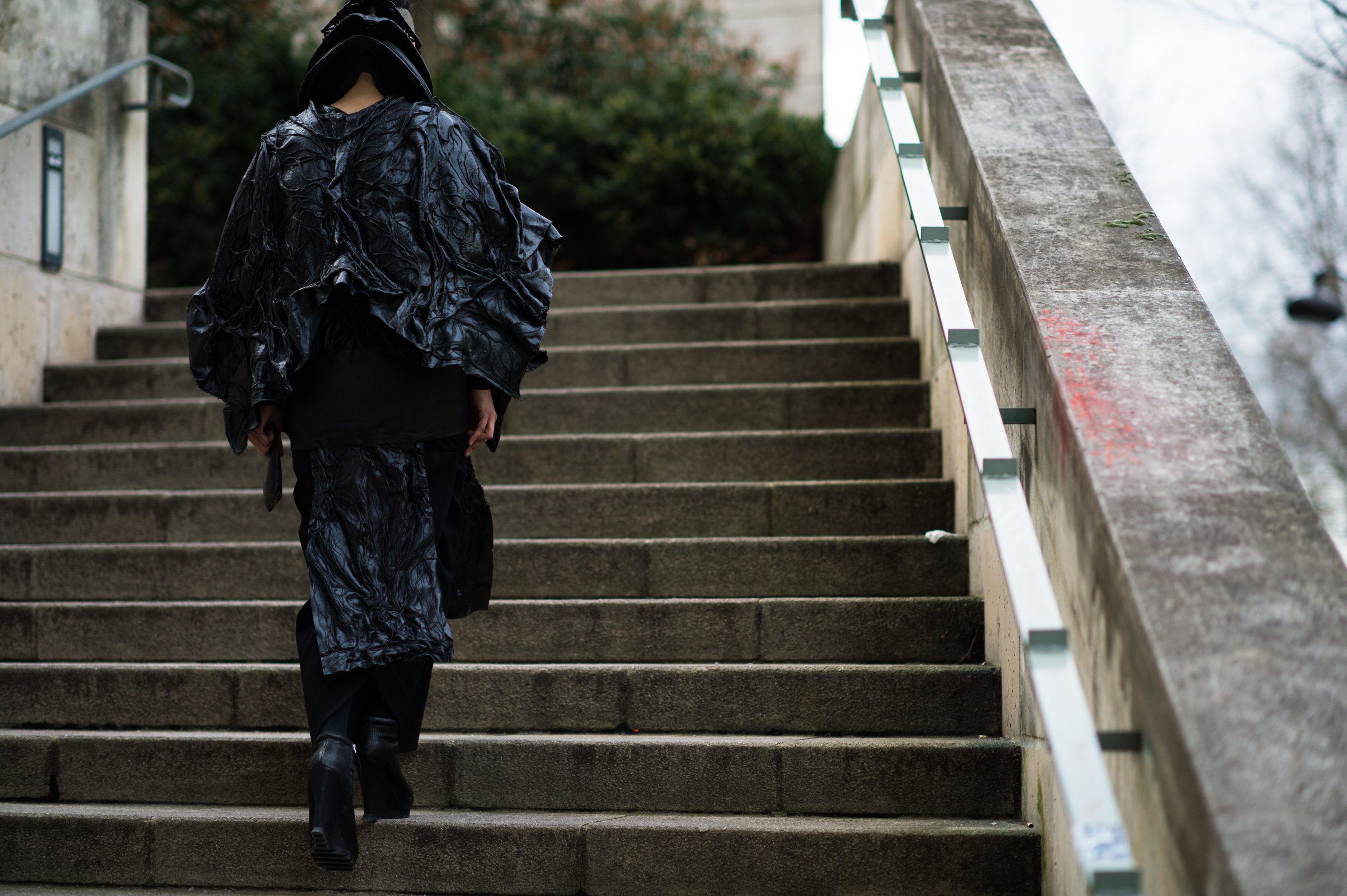 Woman wearing all black on the stairs