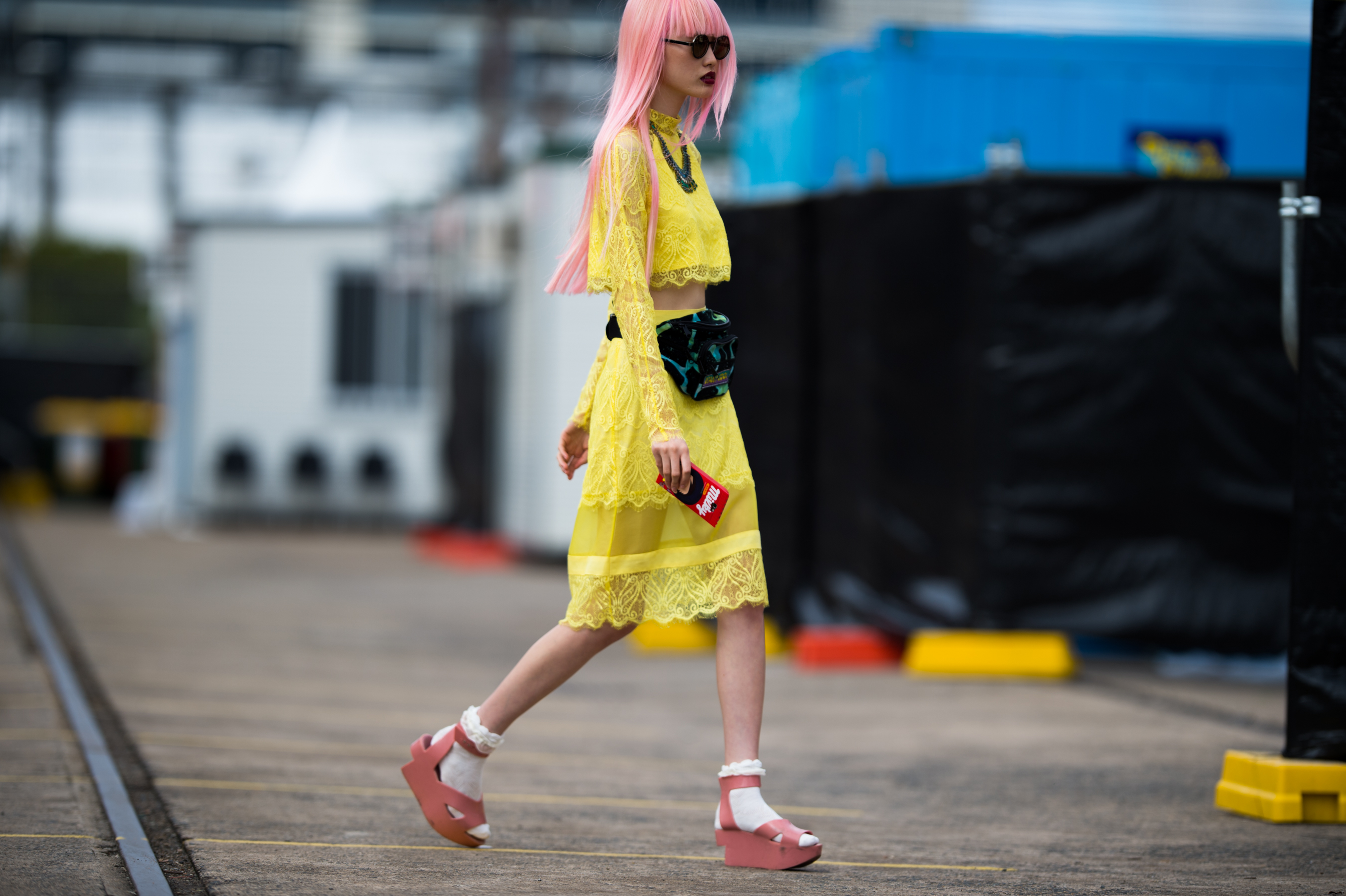 Girl with pink hair in a yellow dress