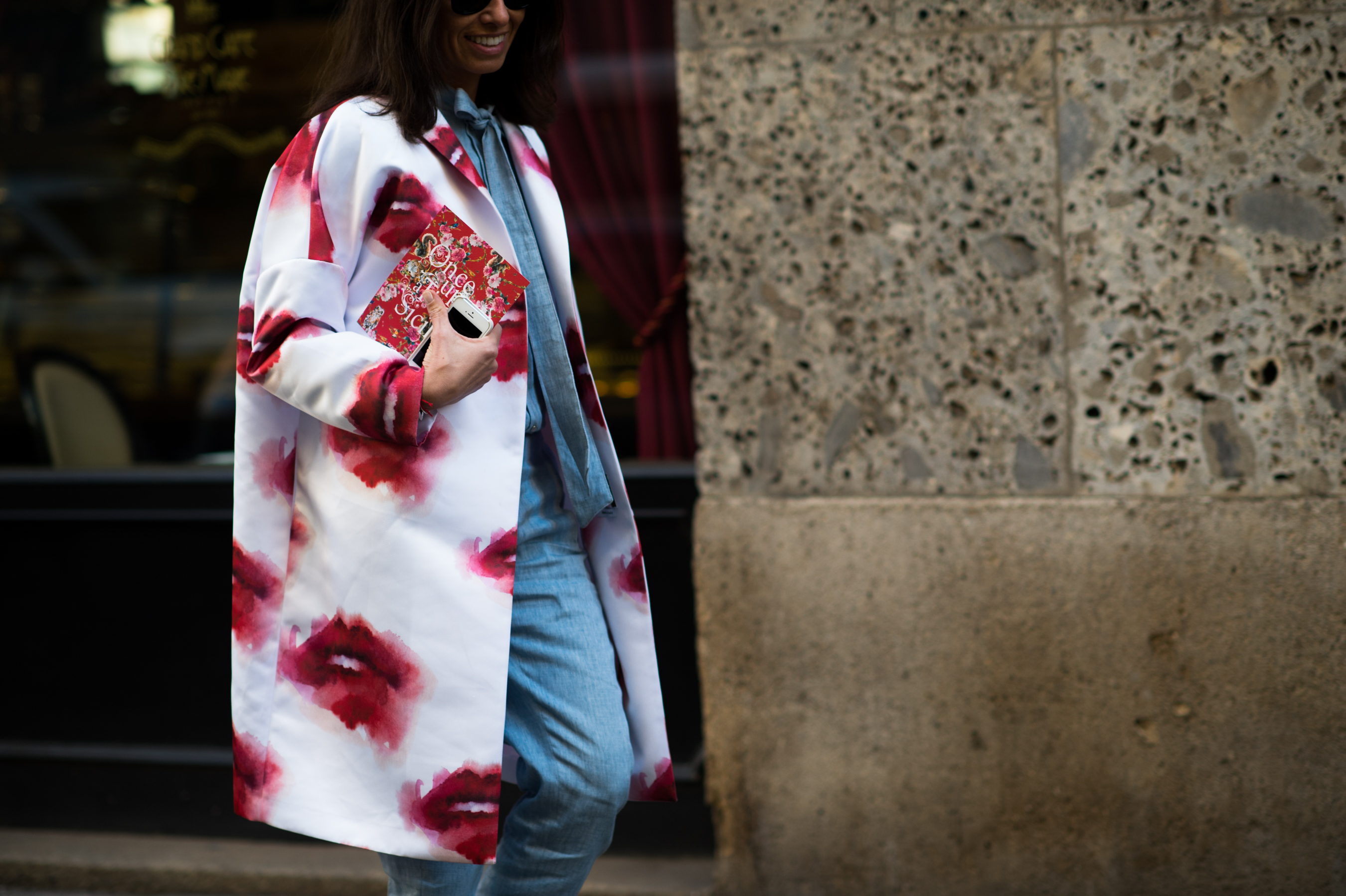 Italian stylist wearing lips coat