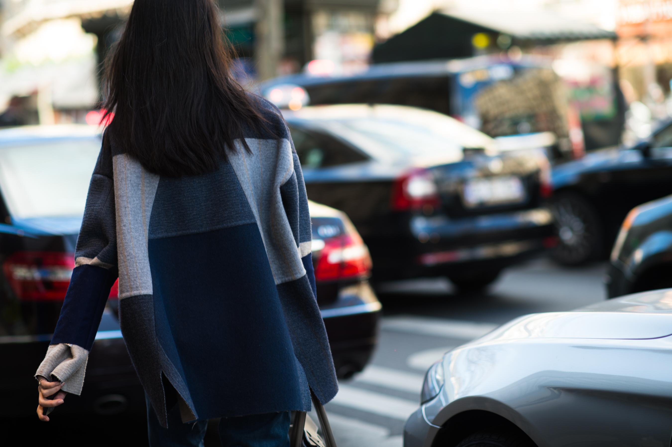 Chinese model wearing a blue jacket