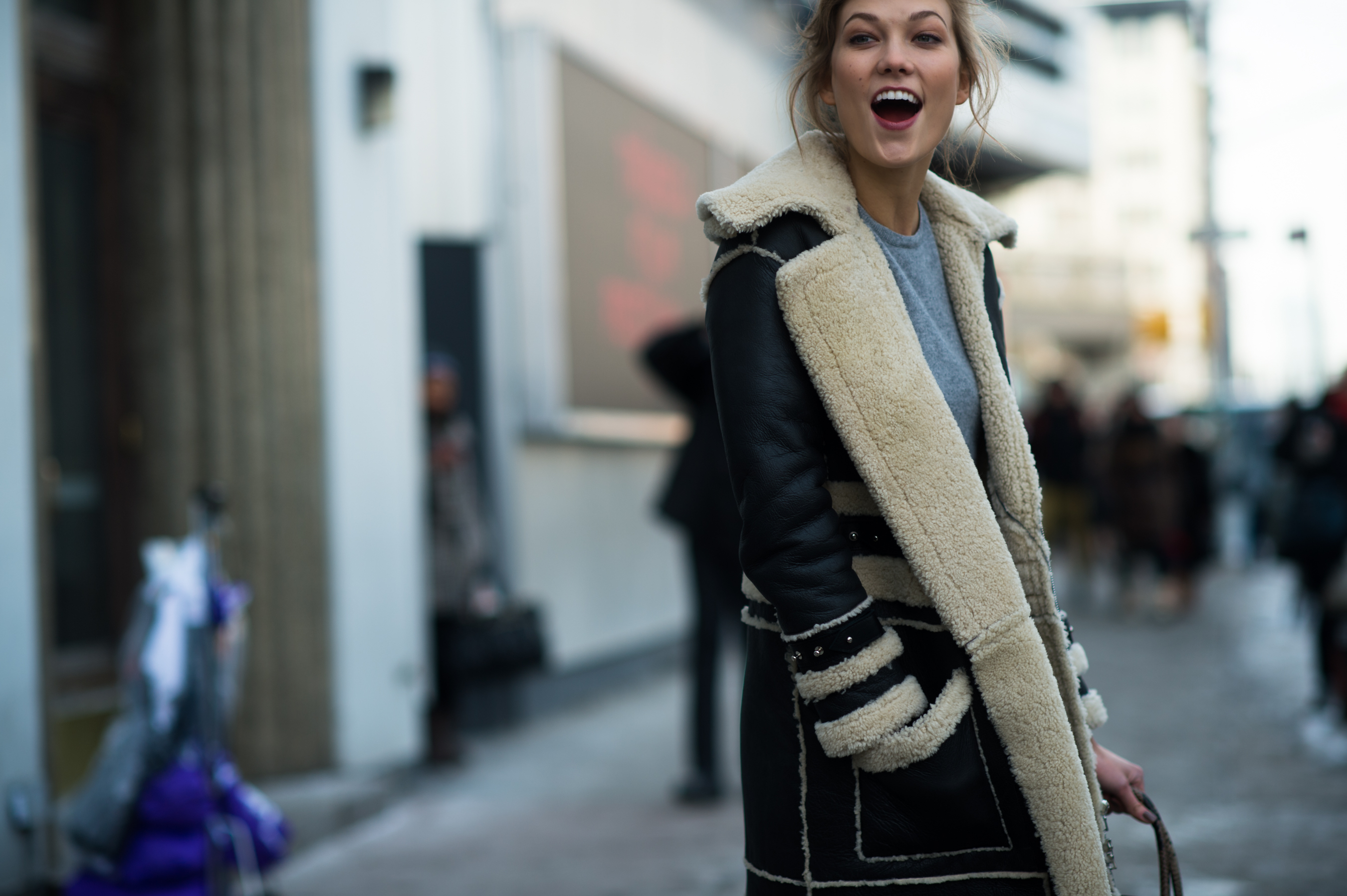 American model wearing a shearling coat