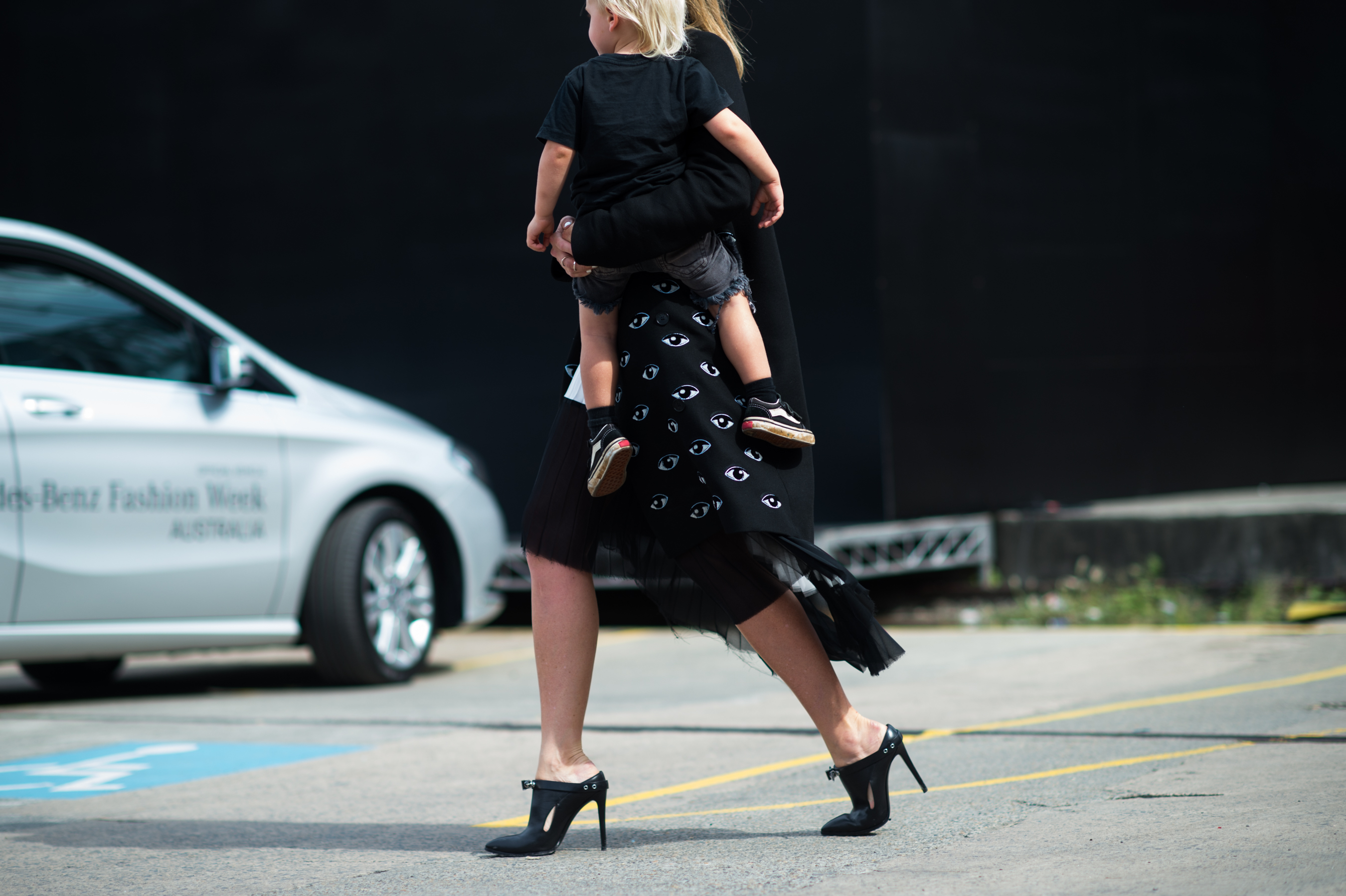 Australian blogger with her son in her arms