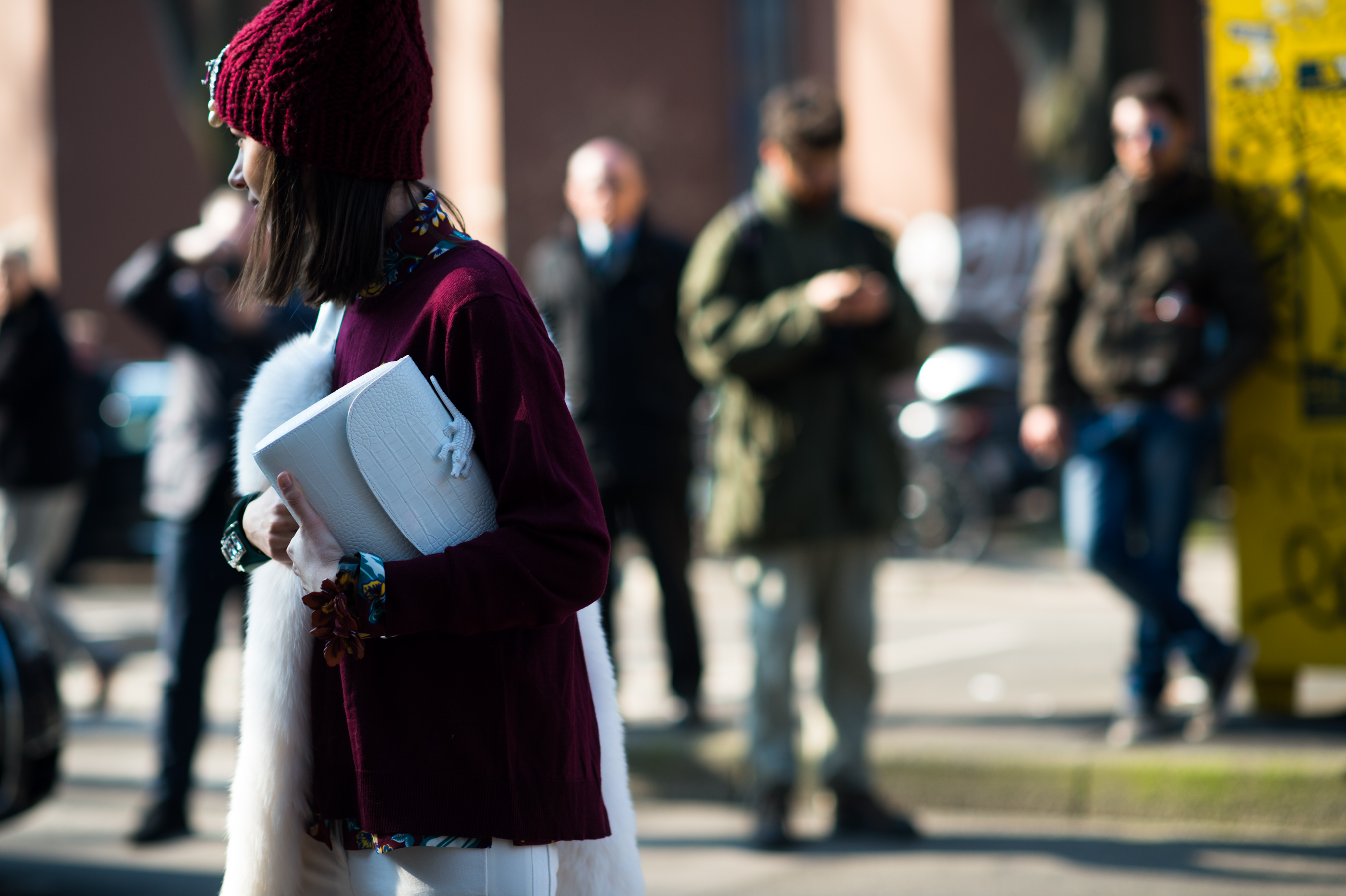 Russian woman wearing oxblood jumper and hat