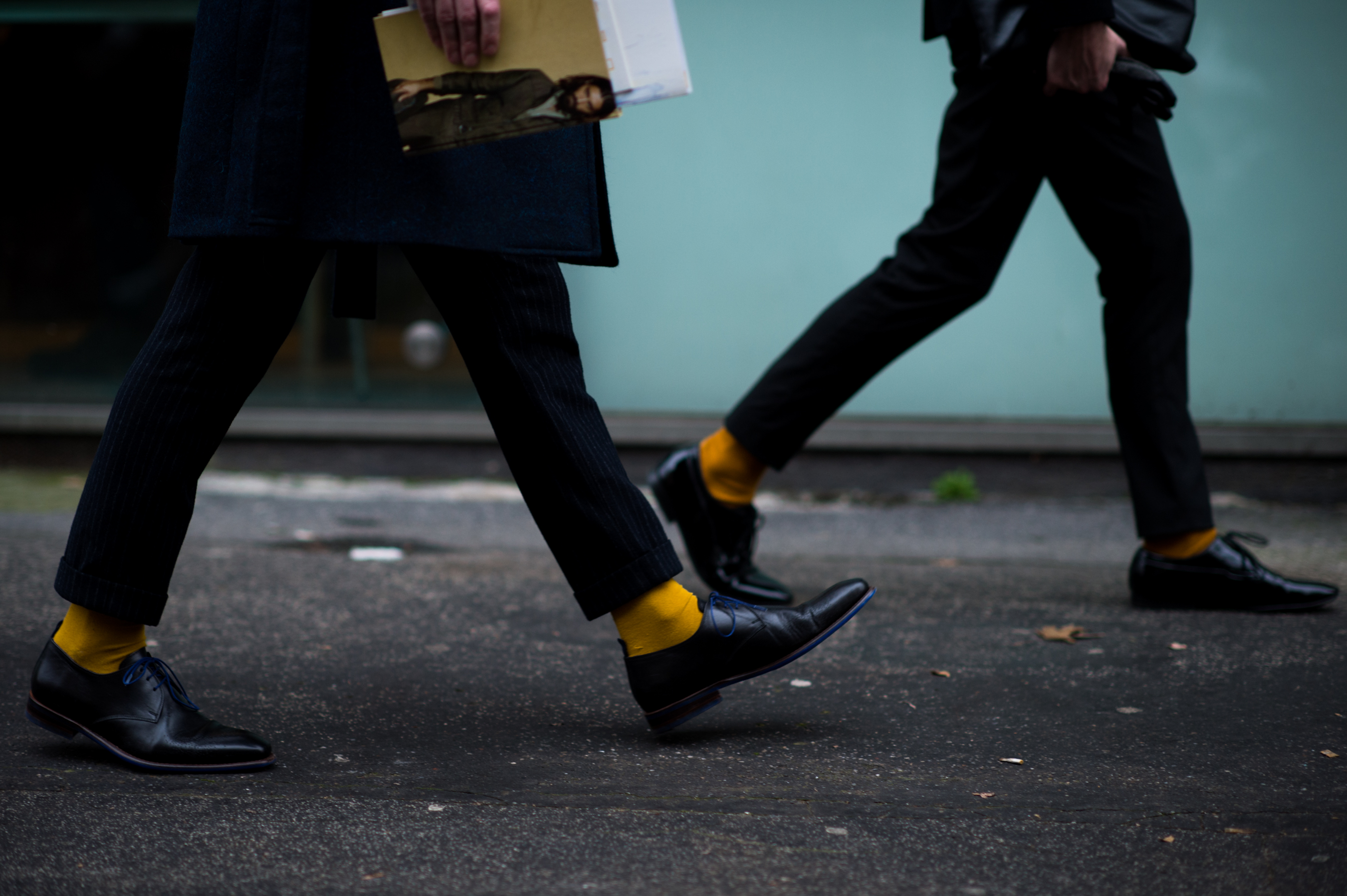 Two men wearing matching yellow socks