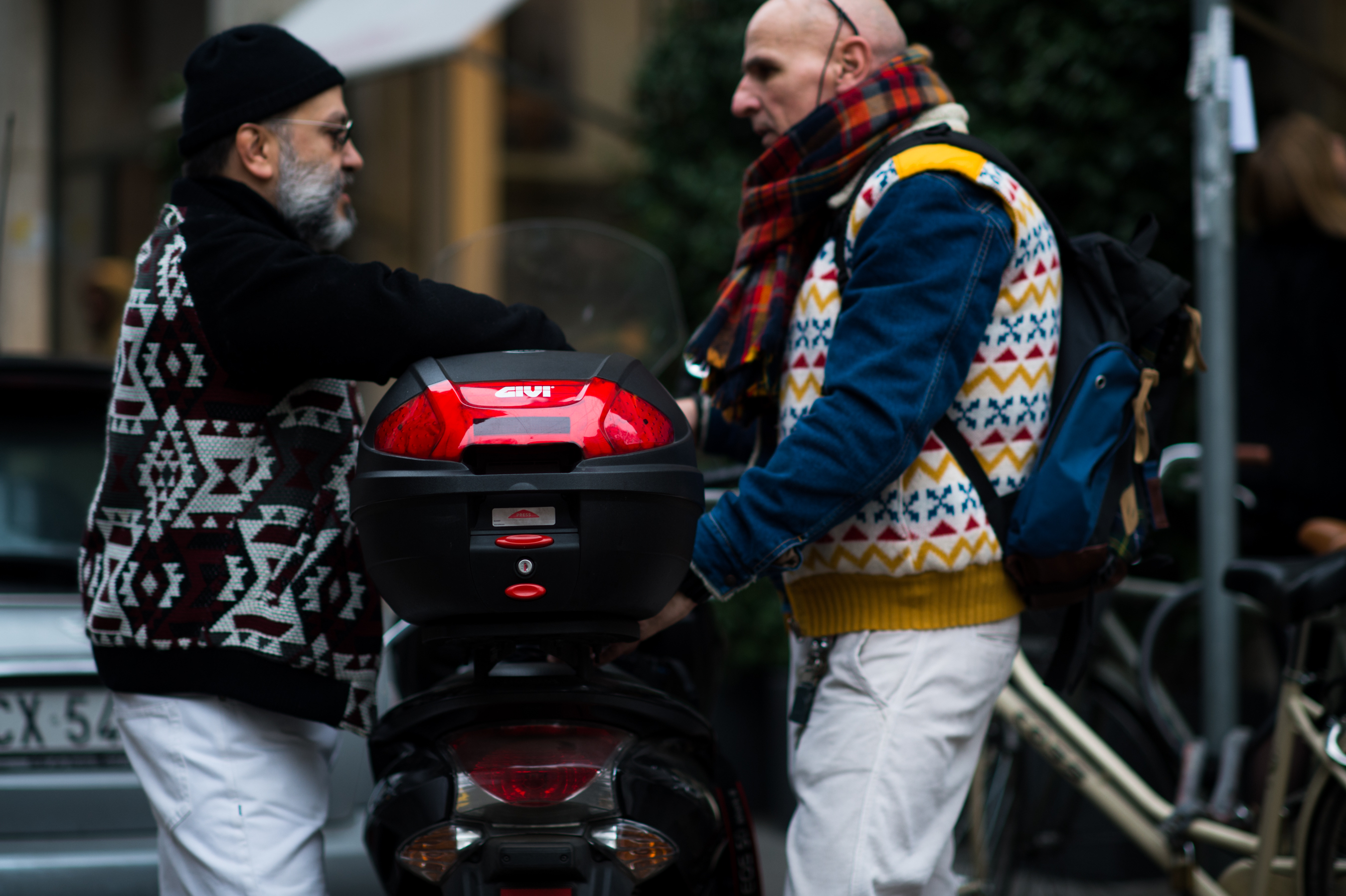 Two men wearing winter sweaters