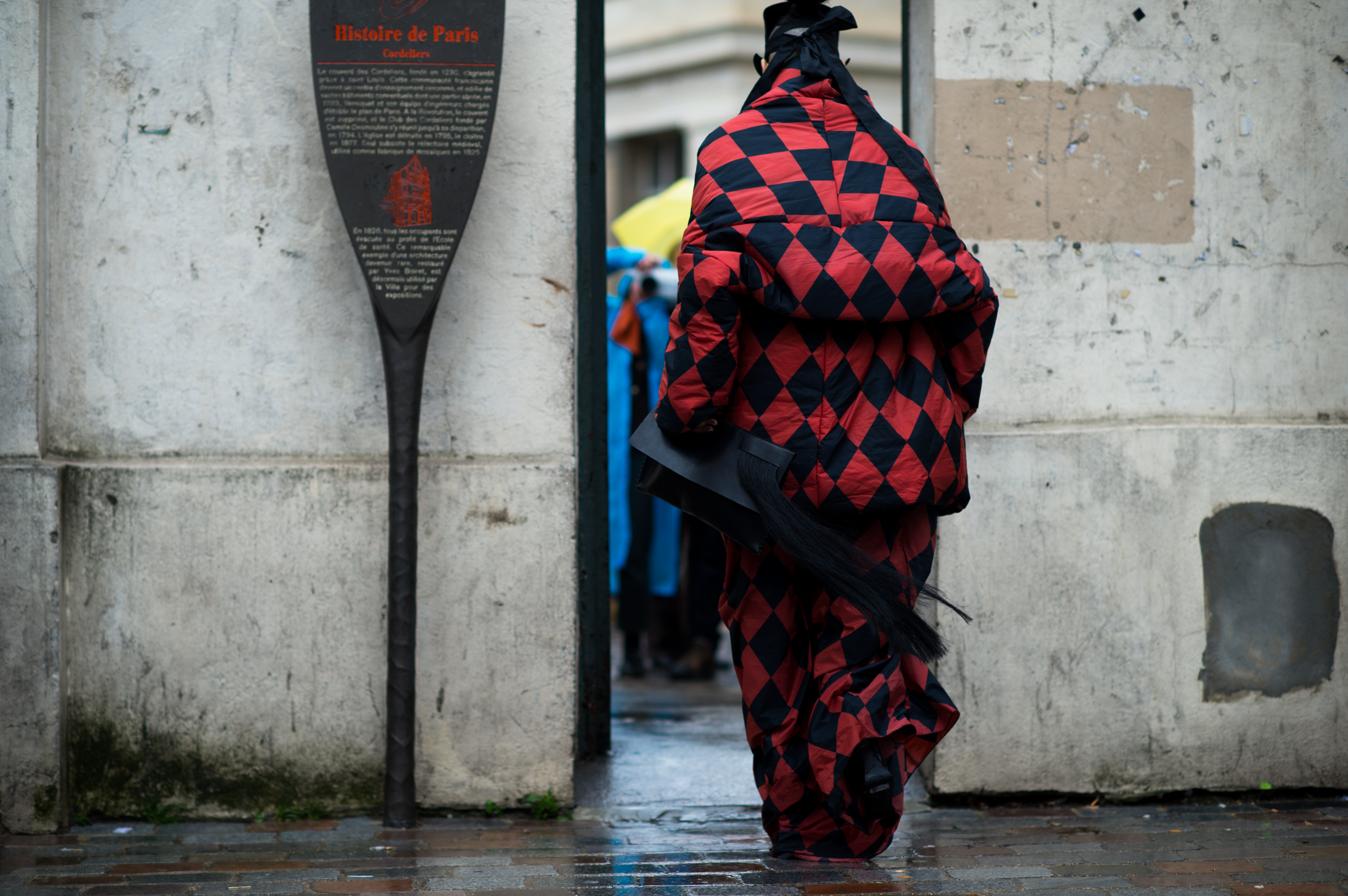 Woman wearing red checkered suit