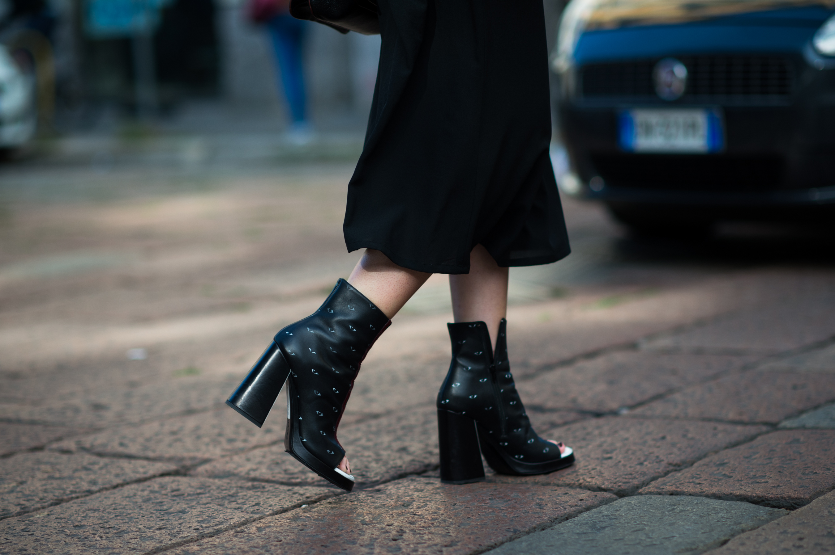 Woman wearing black Kenzo eye heels