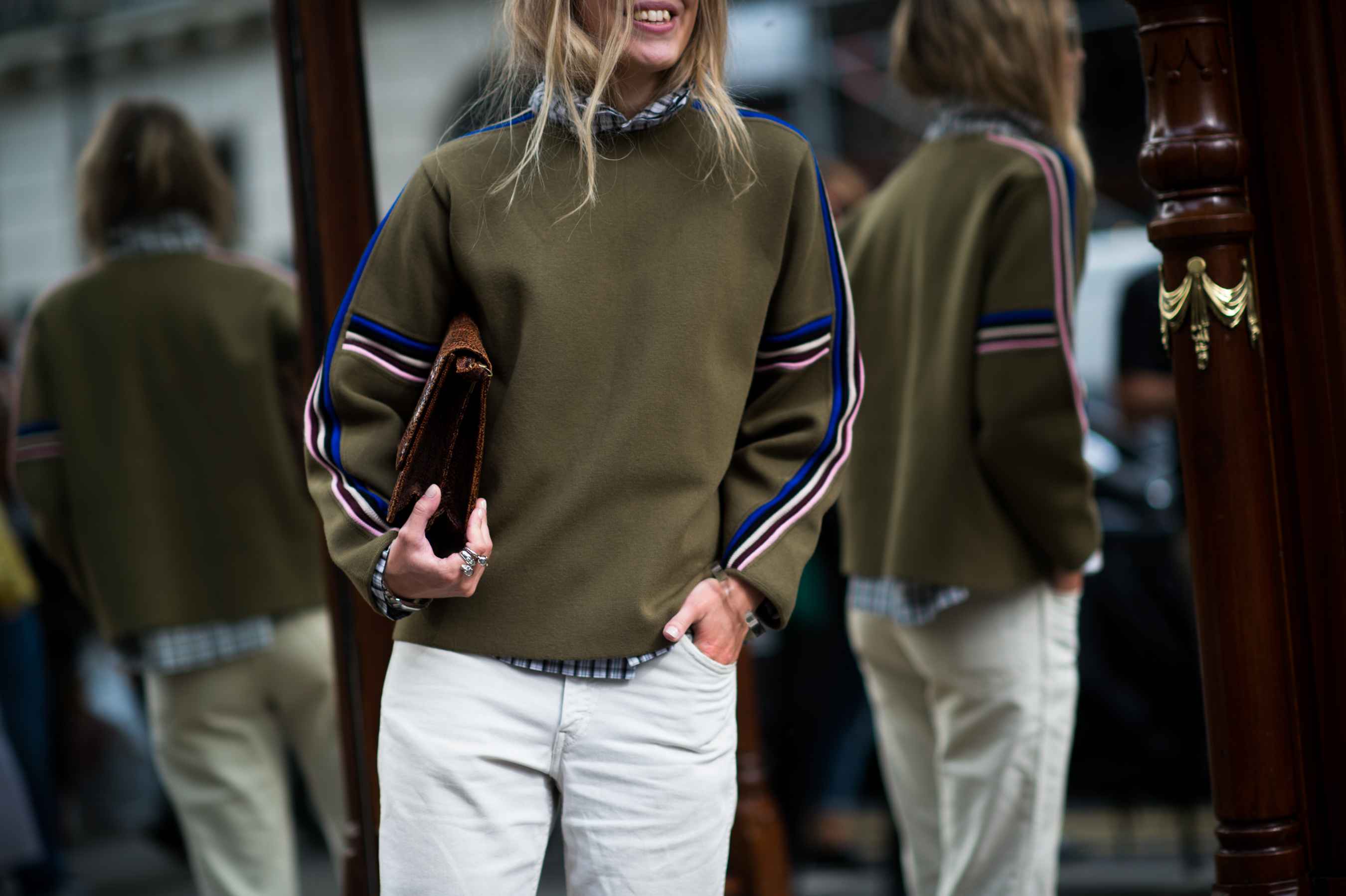 Girl in front of numerous mirrors
