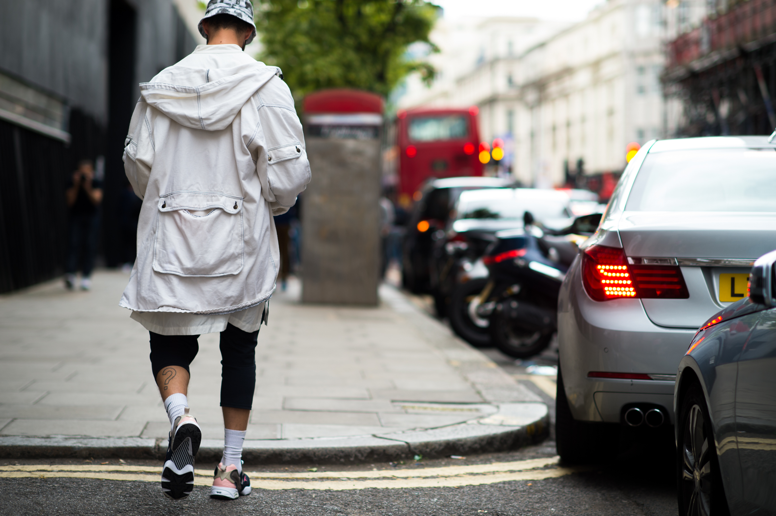 Man wearing white cargo coat