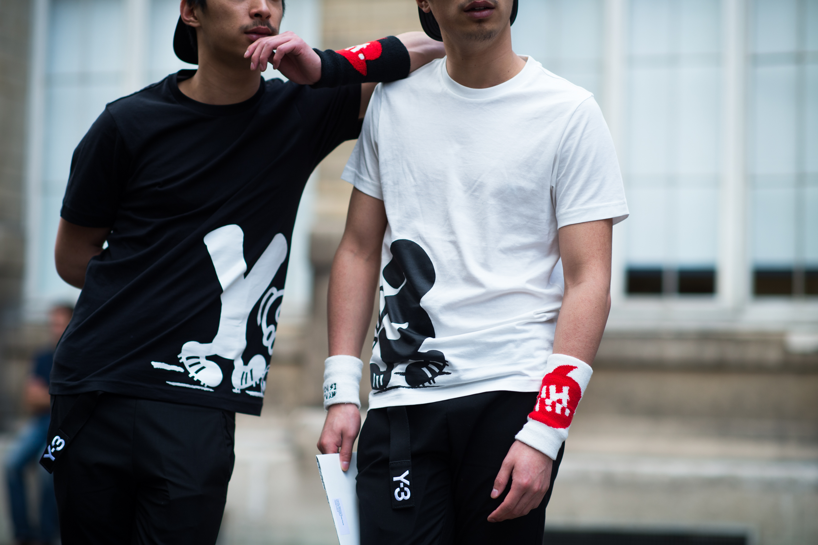 Two men wearing matching outfits