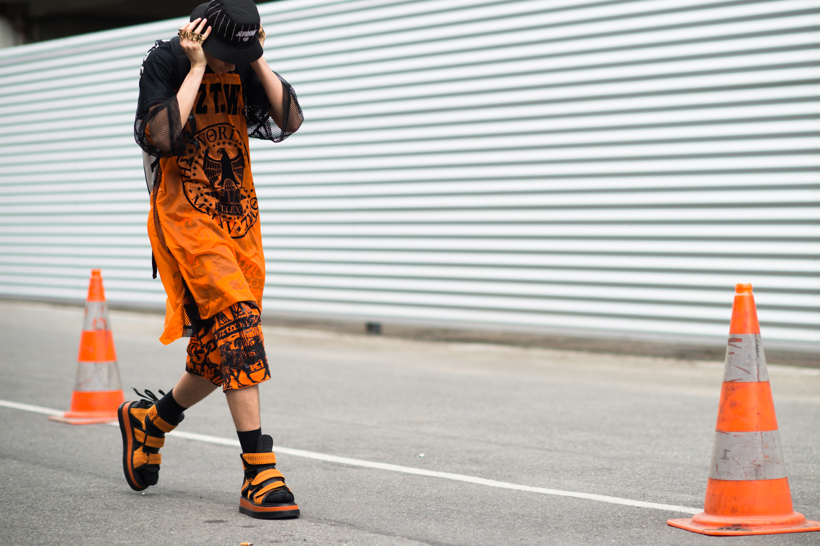 French boy wearing orange KTZ outfit