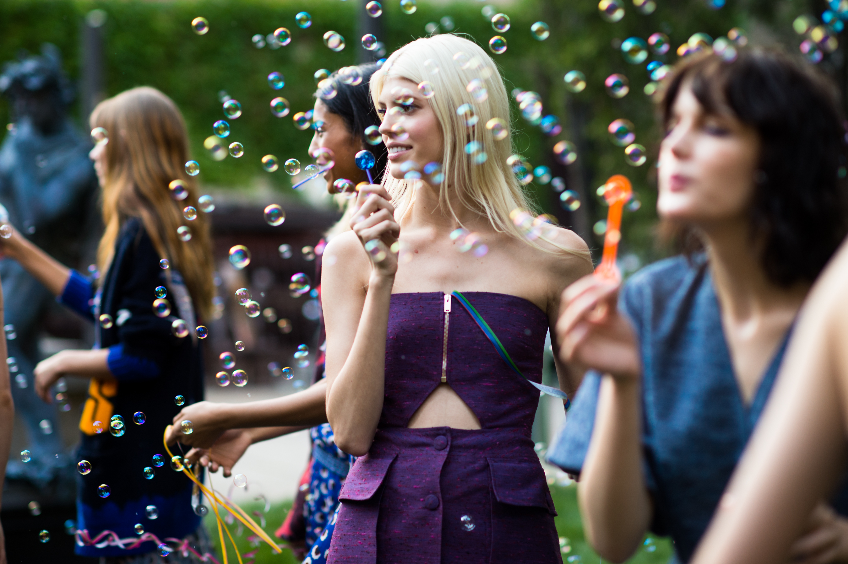 Models blowing soap bubbles in NYC