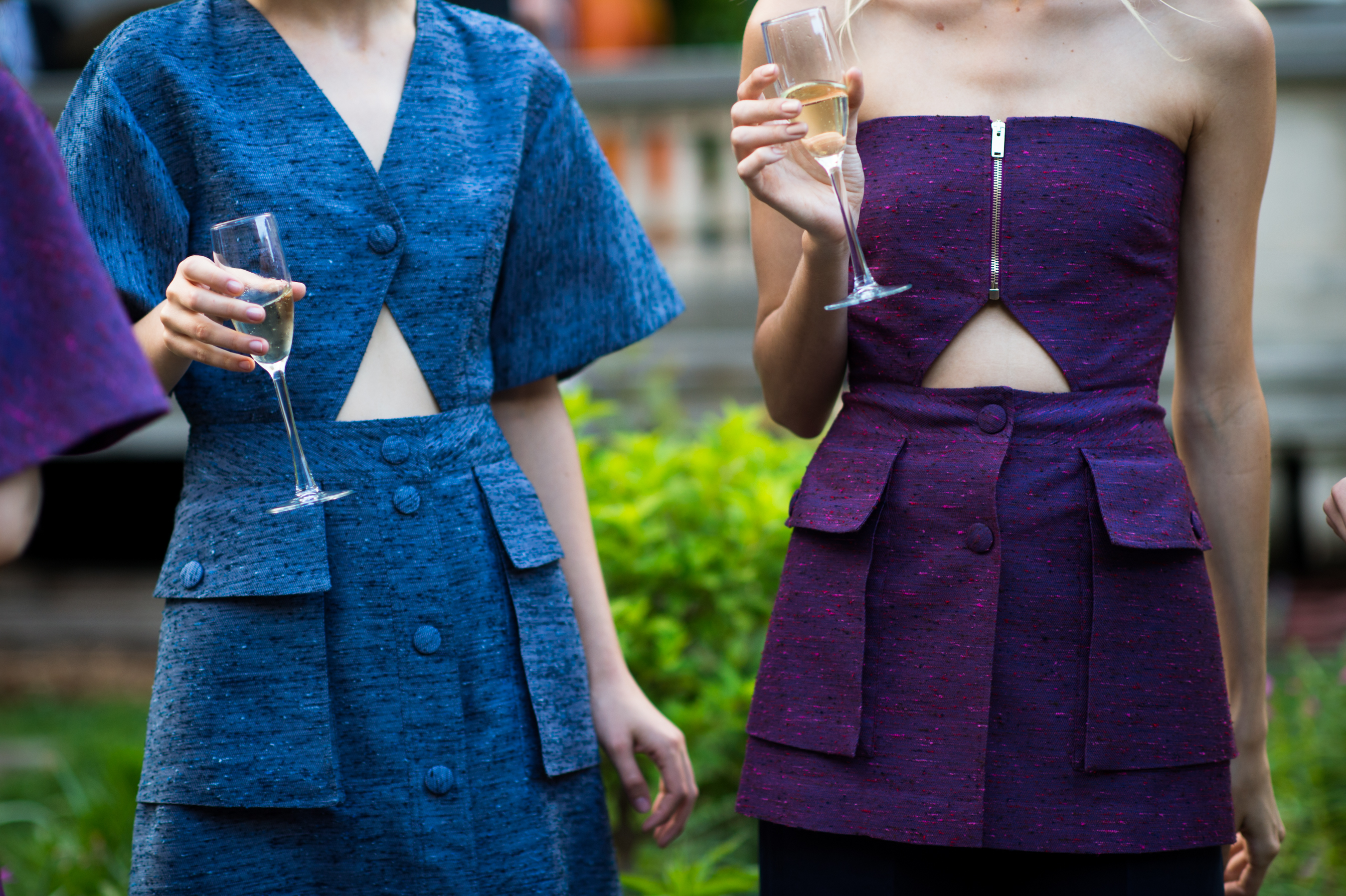 Two models at a garden party