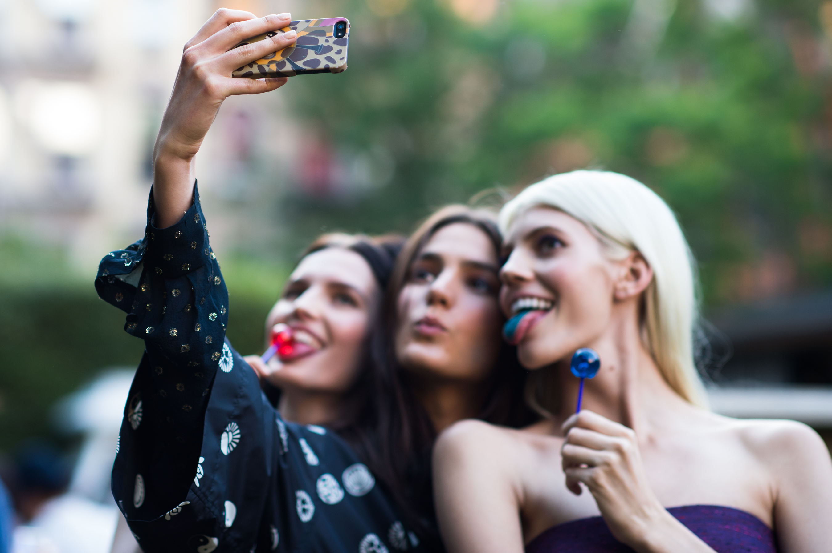 Three models taking a selfie in NYC