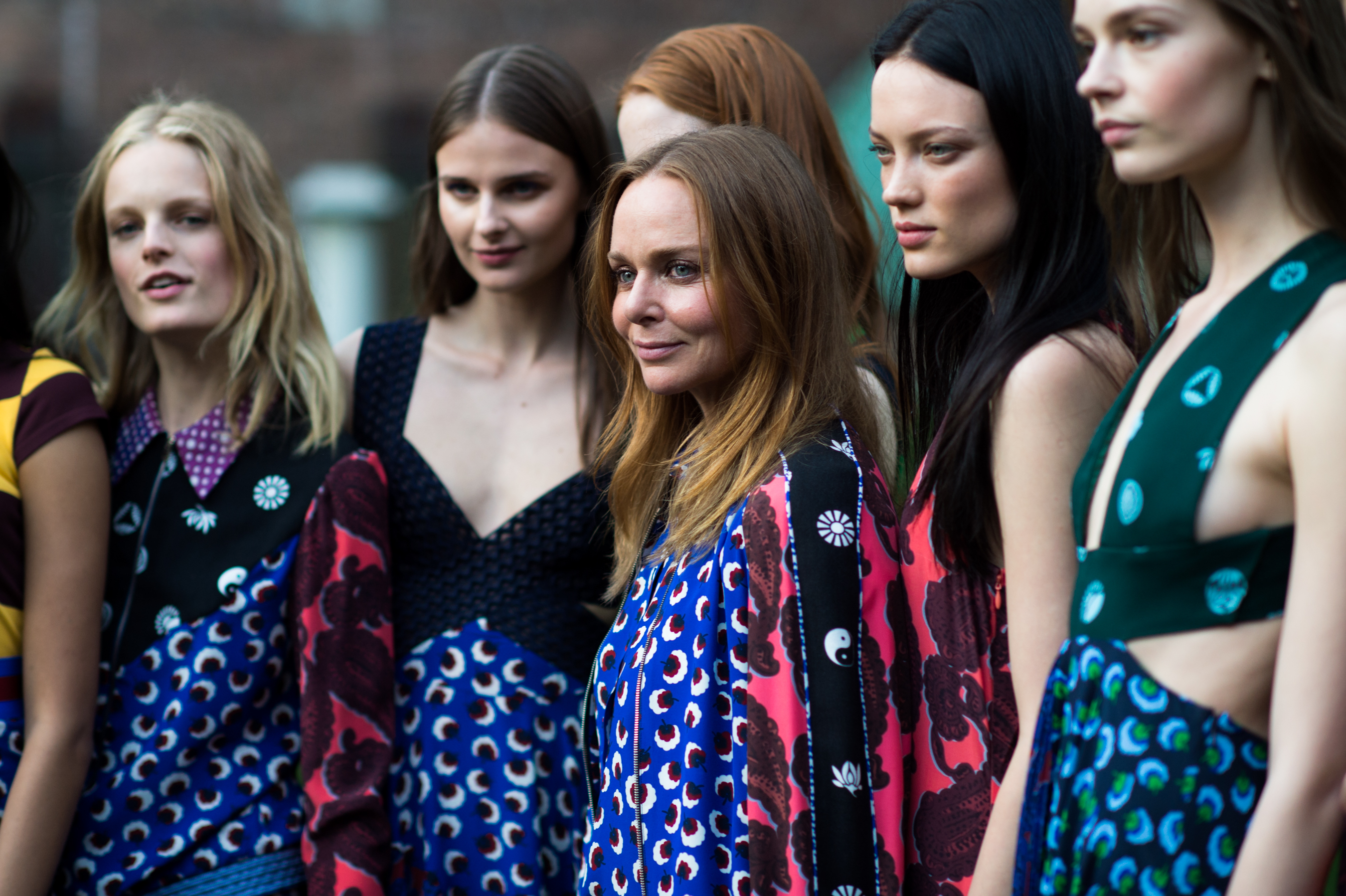 The designer with a group of models