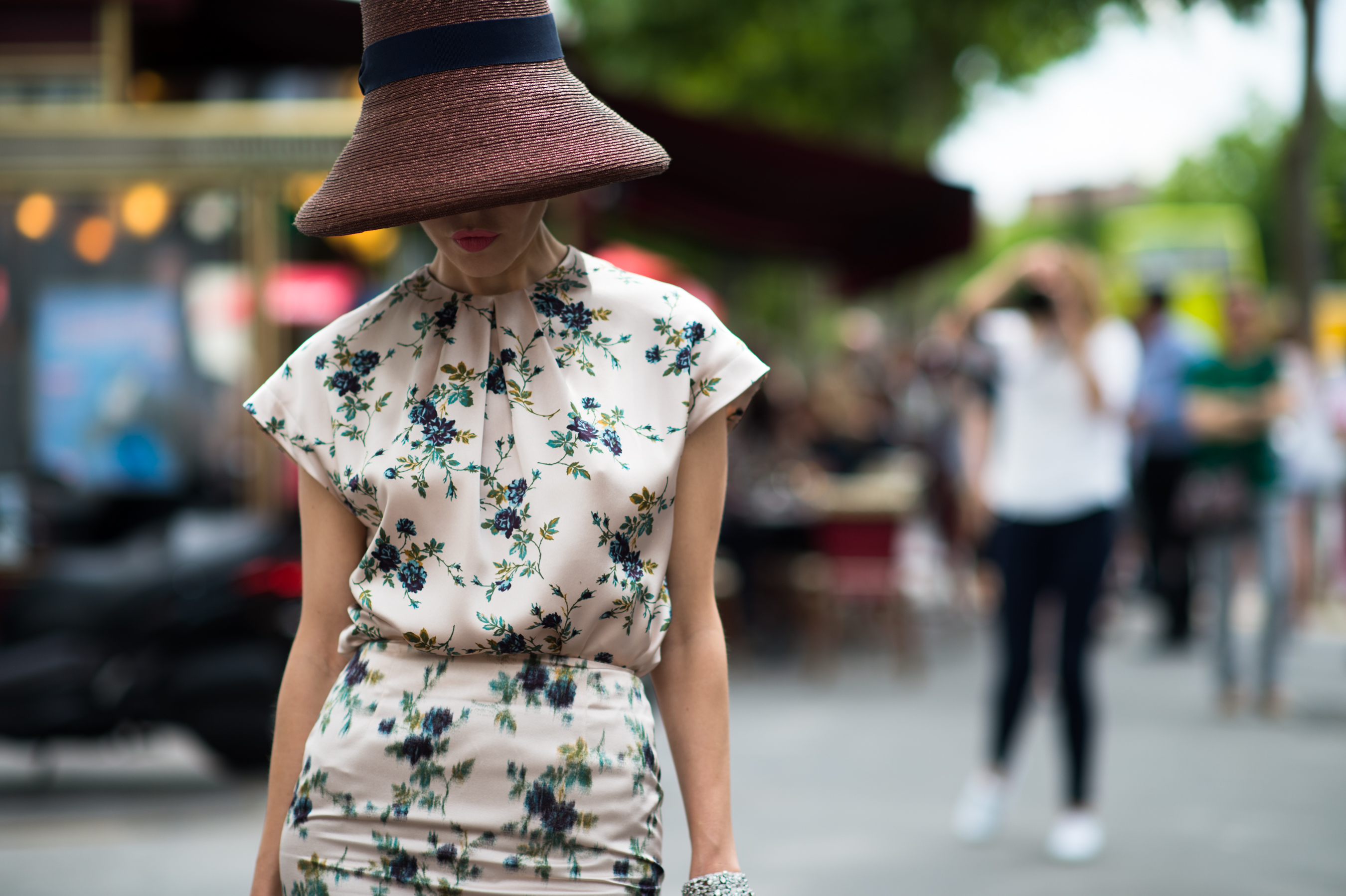 Kazakh woman wearing a floral dress and big hat
