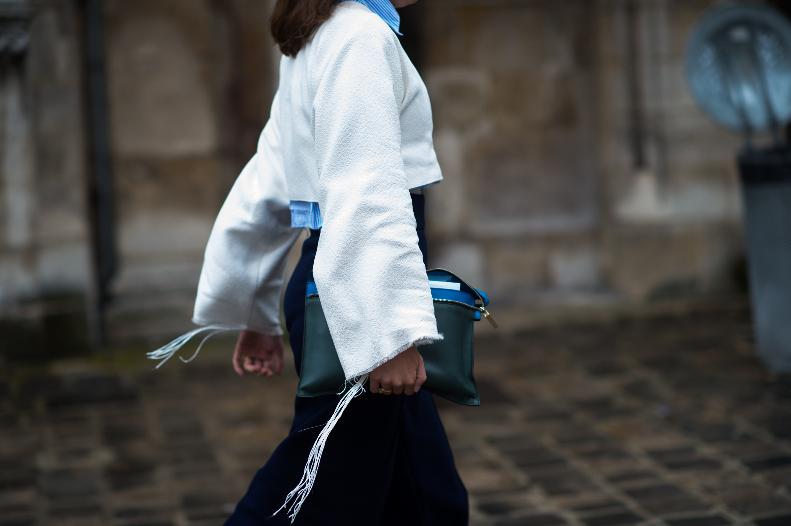 Woman wearing raw edge white top