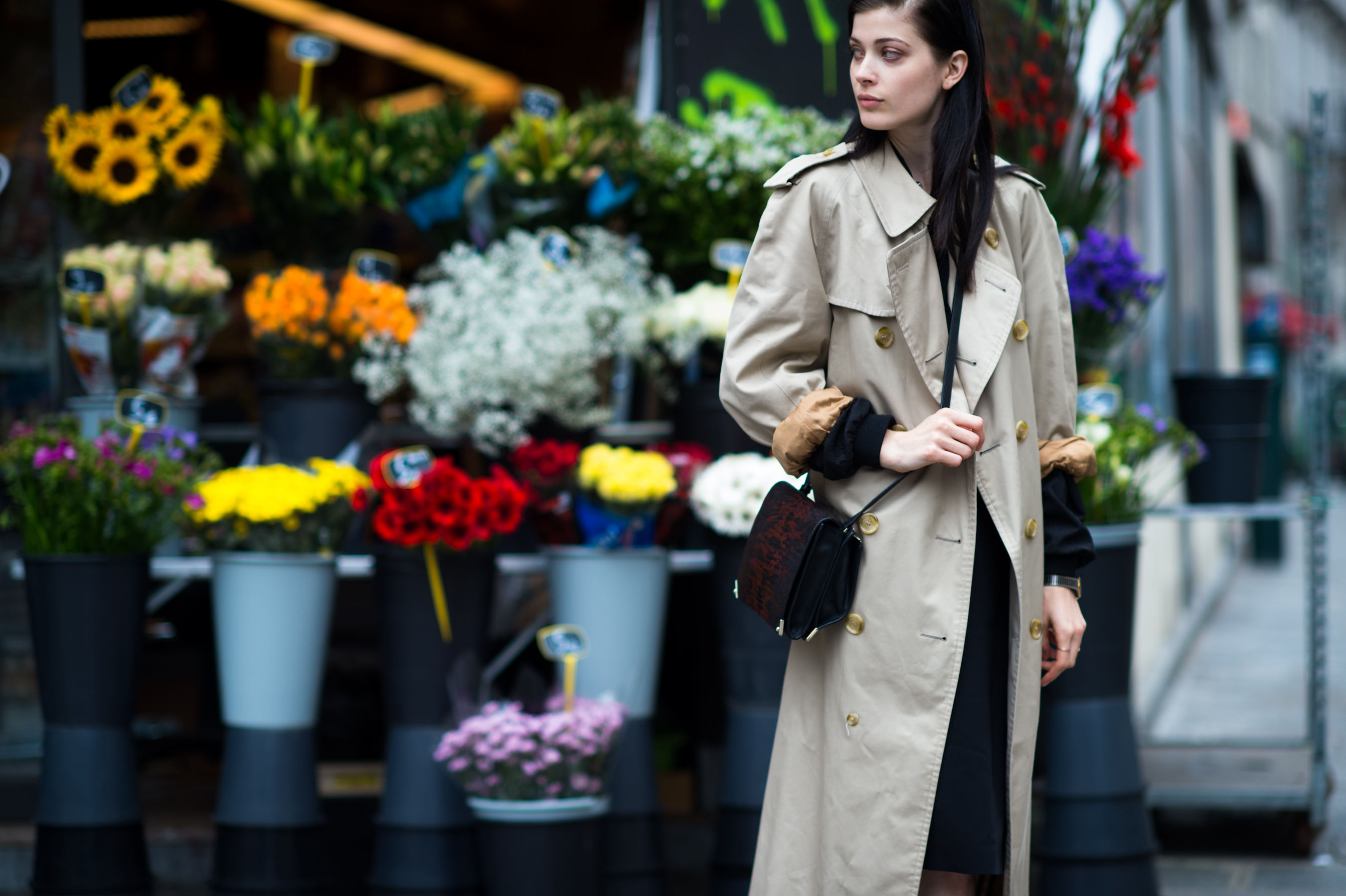 German model in front of a flower shop