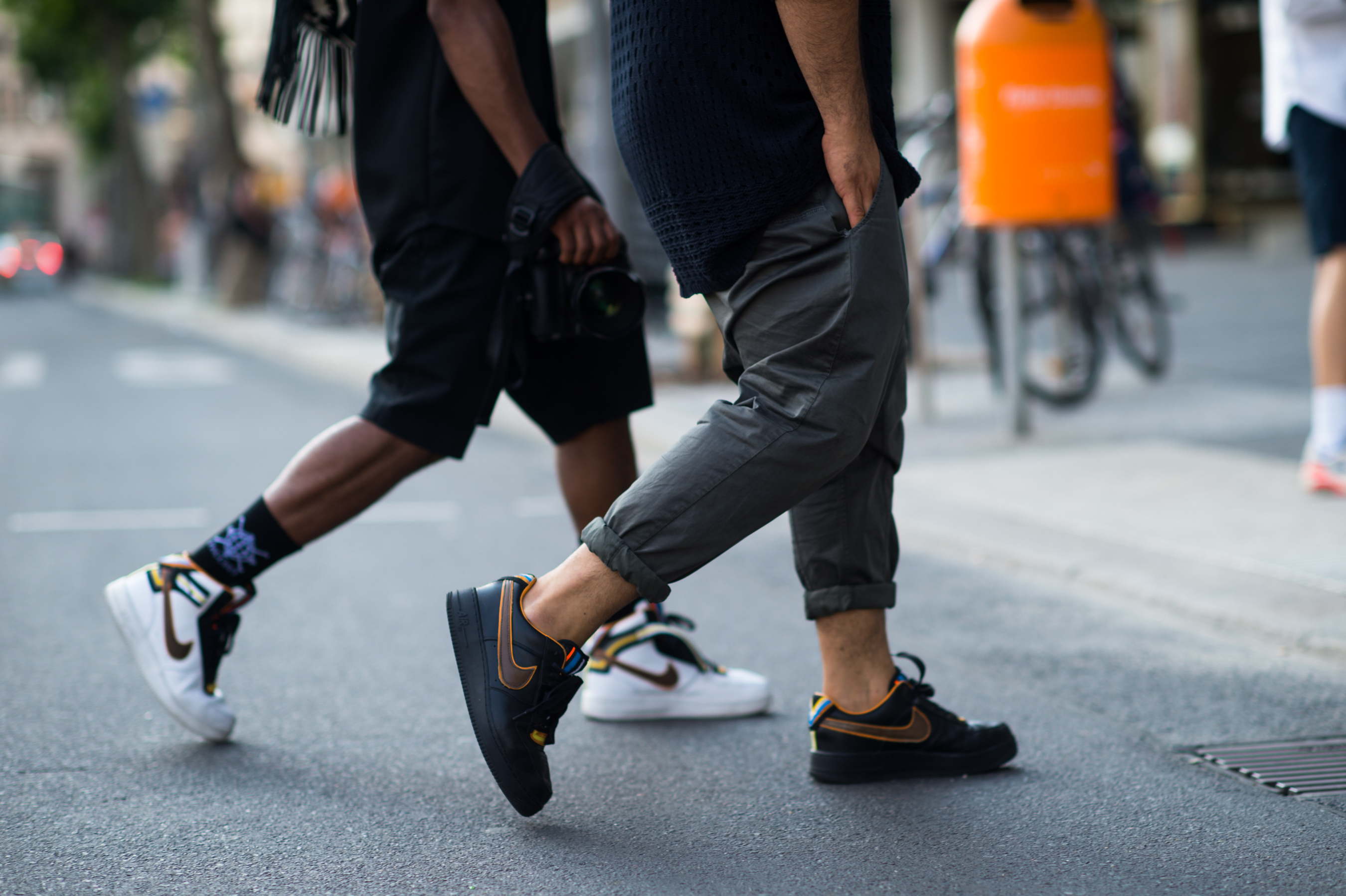Two men wearing Nike by Ricardo Tisci sneakers