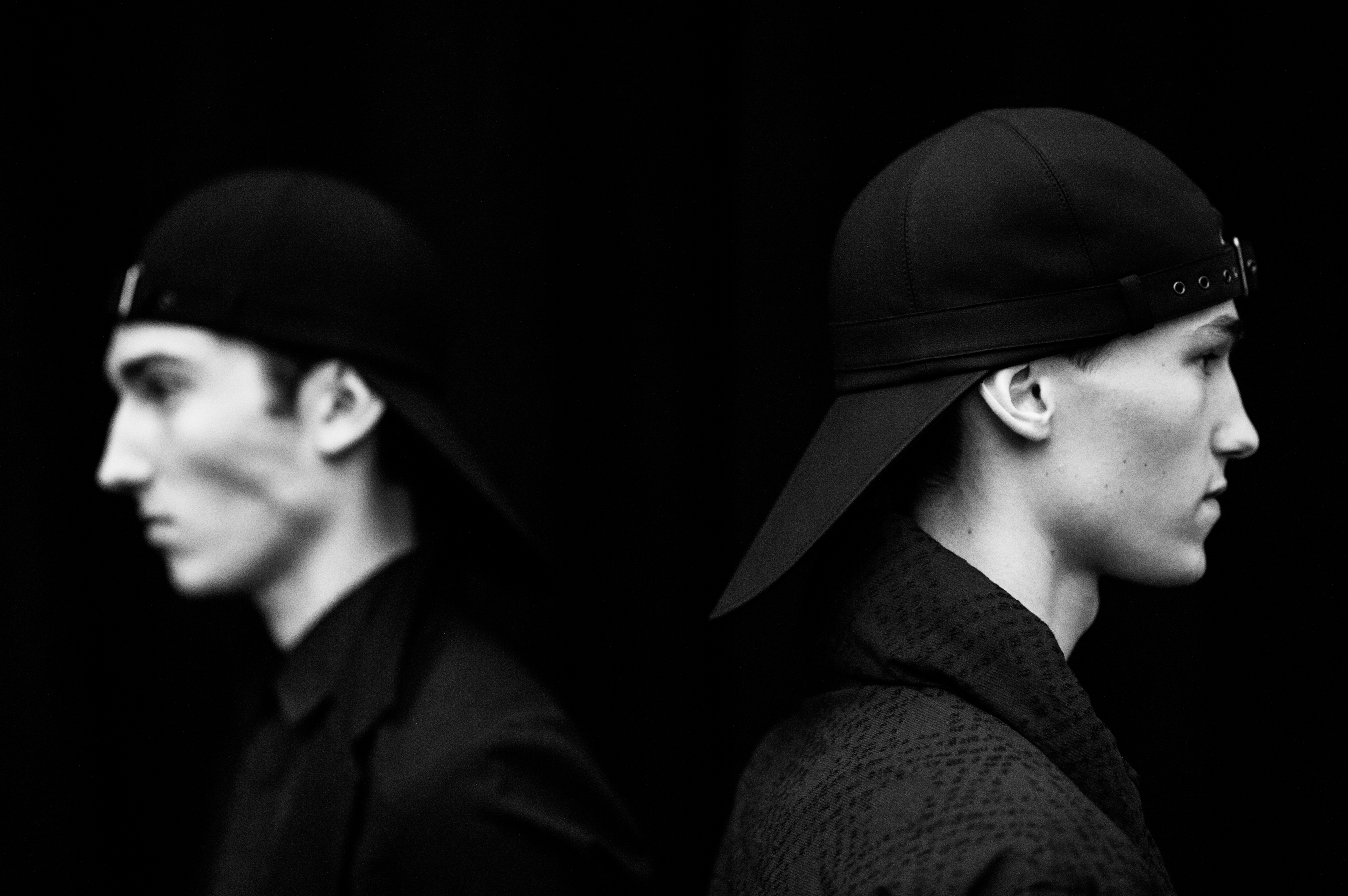 Male models wearing matching hats