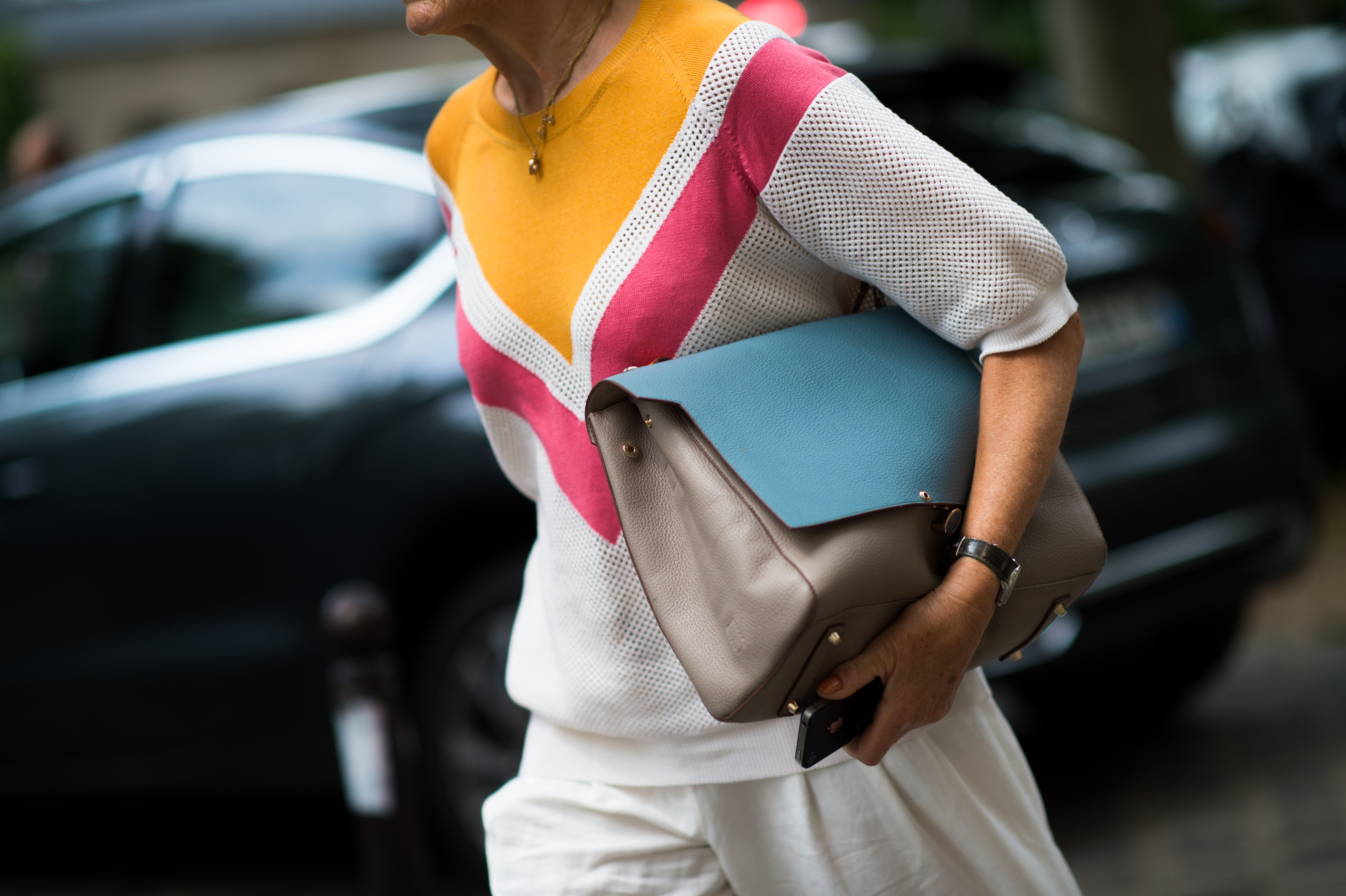 Woman wearing yellow, pink, and blue