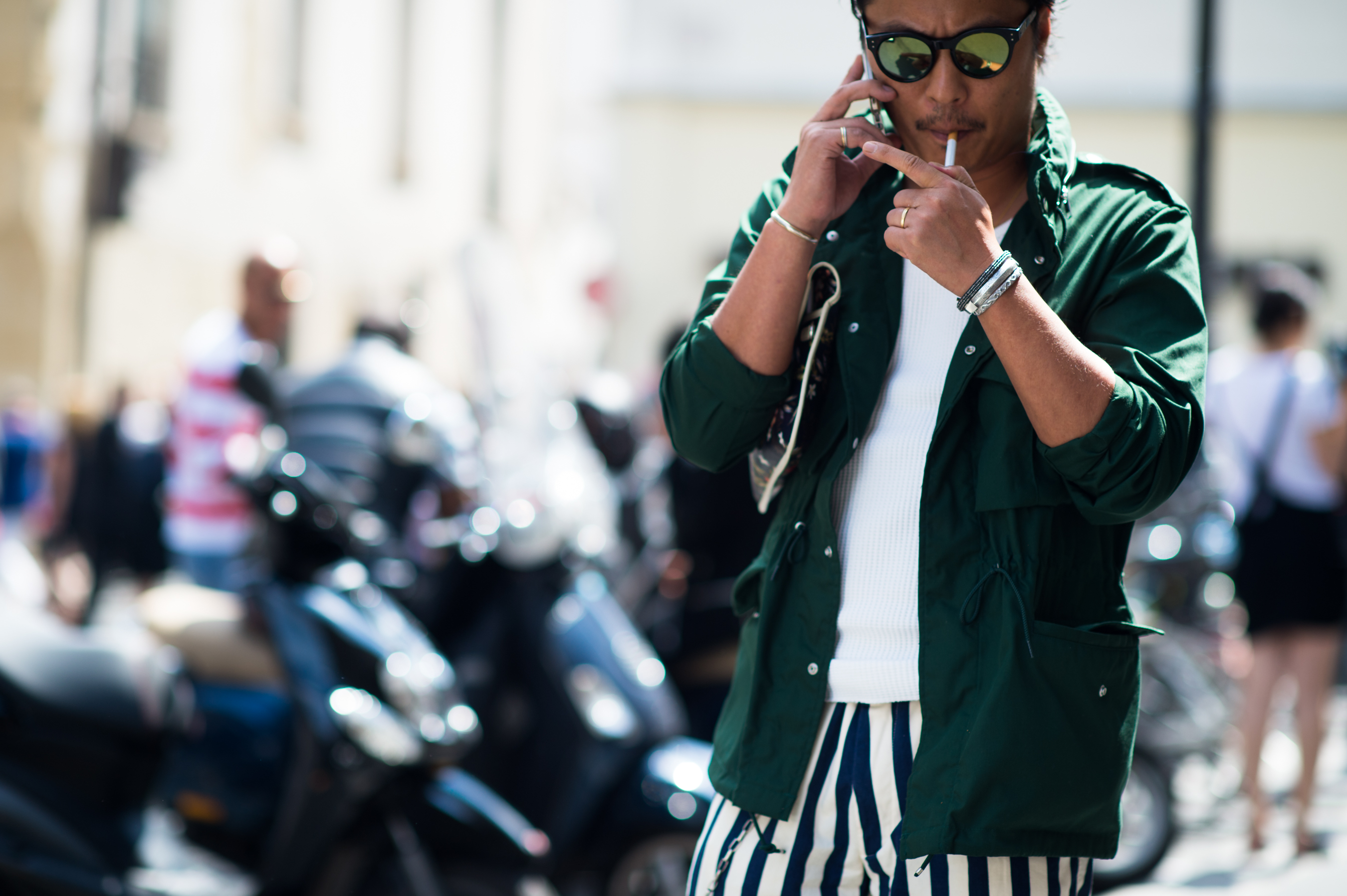 Japanese man wearing green while smoking