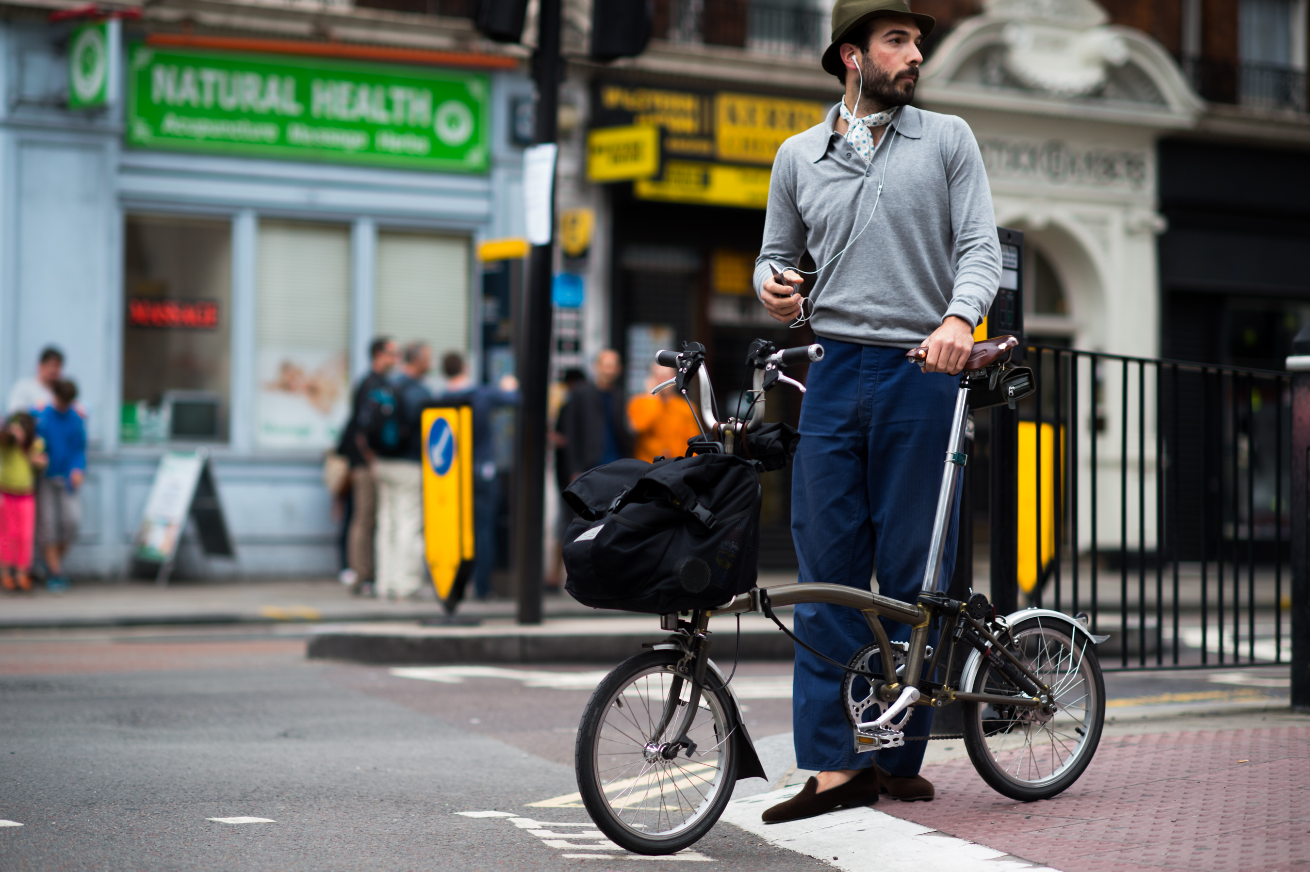 Cool guy riding compact bicycle